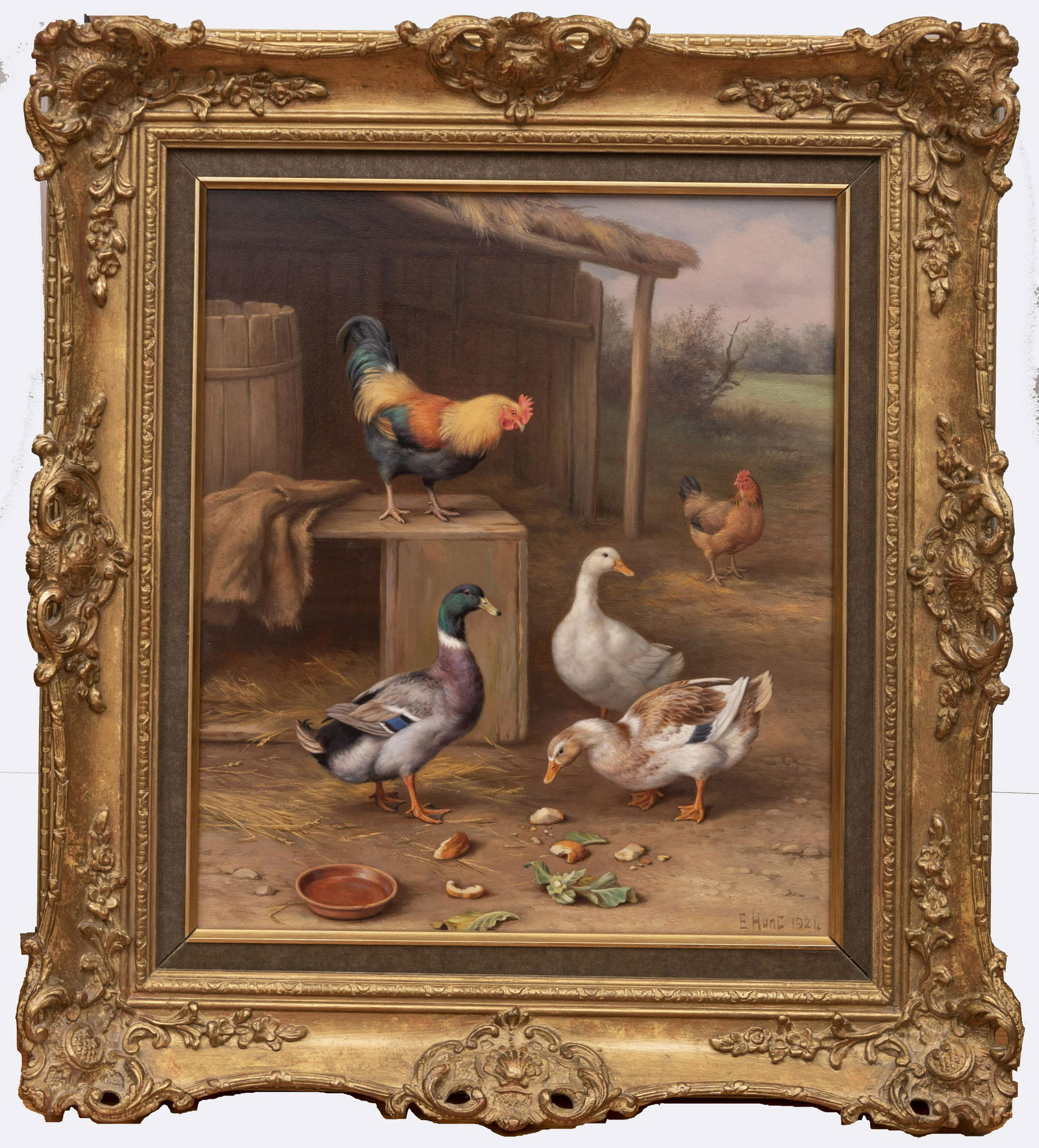 Edgar Hunt, British (1876-1955), A Hen, Cockerel and: Edgar HuntBritish (1876-1955)A Hen, Cockerel and Ducks Outside a Barn, 1924oil on canvassigned and dated lower right, gilt-framed. Provenance: Richard Green, LondonProperty from a Prominent Saint Lo