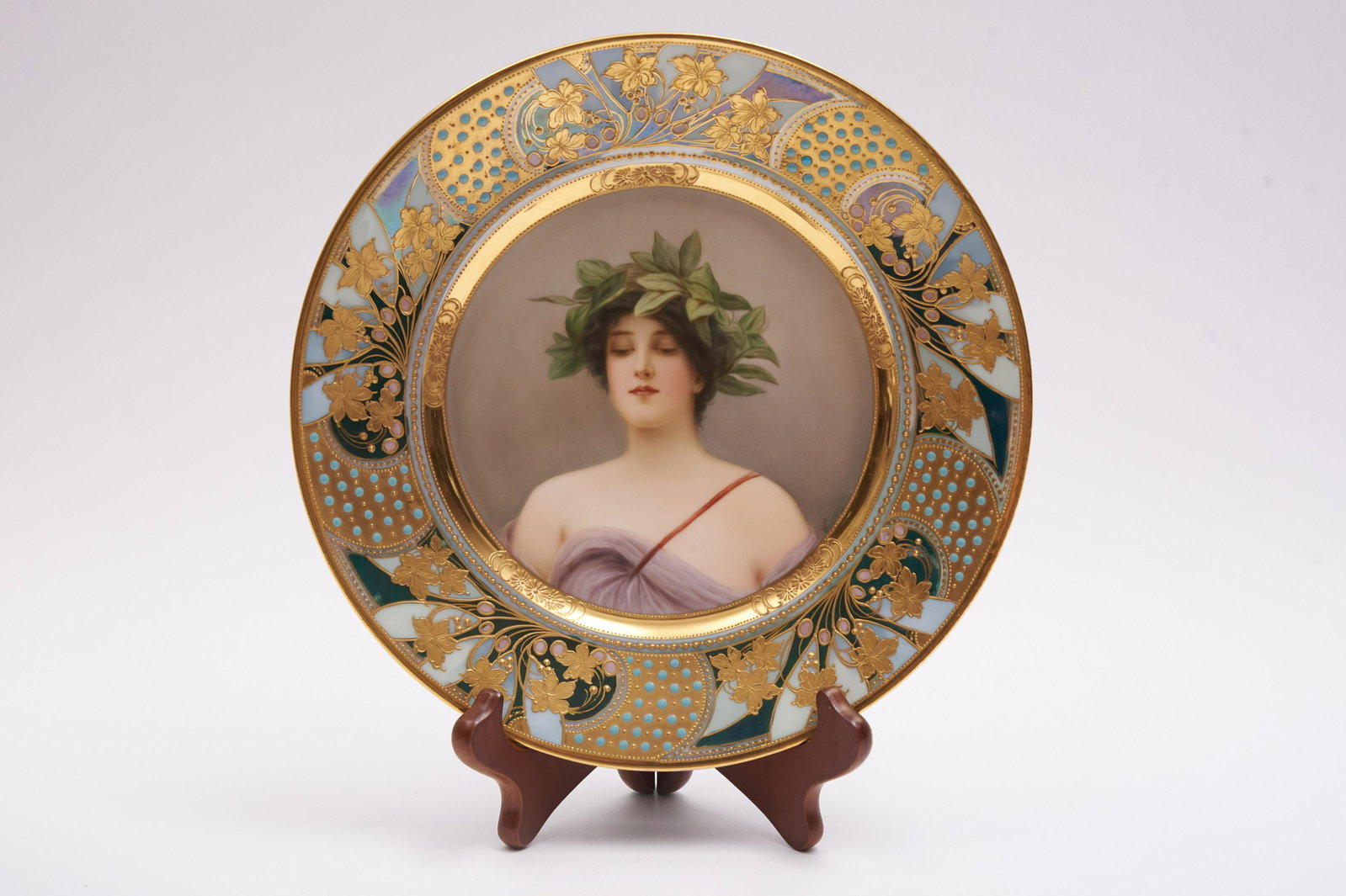 Royal Vienna Portrait Plate, "Daphne", signed Wagner: Royal Vienna Portrait Plate, "Daphne", signed Wagner Hand painted and gilt decorated portrait plate depicting a neoclassic style woman wearing a floral head wreath The Art Nouveau style bord