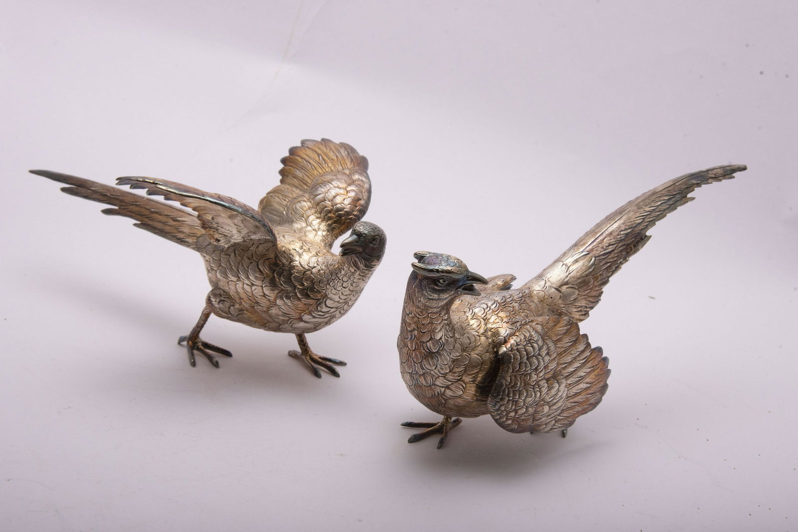 Pair of Sterling Silver Pheasant Table Ornaments, 18.58: Pair of Sterling Silver Pheasant Table Ornaments, 18.58 Troy OuncesWell modelled and chased Pheasants with multiple silver marks, including Sterling & 925, Germany, IF & Son18.58 Troy Ounces9" in