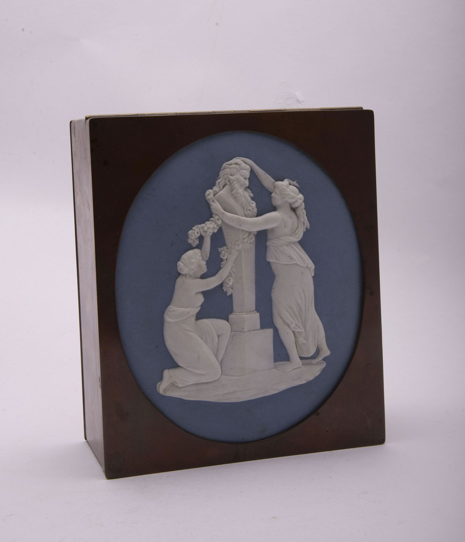 19th Century Jasperware and Brass Mounted Box Top of: 19th Century Jasperware and Brass Mounted BoxThe hinged box with a large oval jasper plaque depicting 2 maidens at a statue of a satyrTop of box 6"x7", 3" tall, plaque 6.25" long