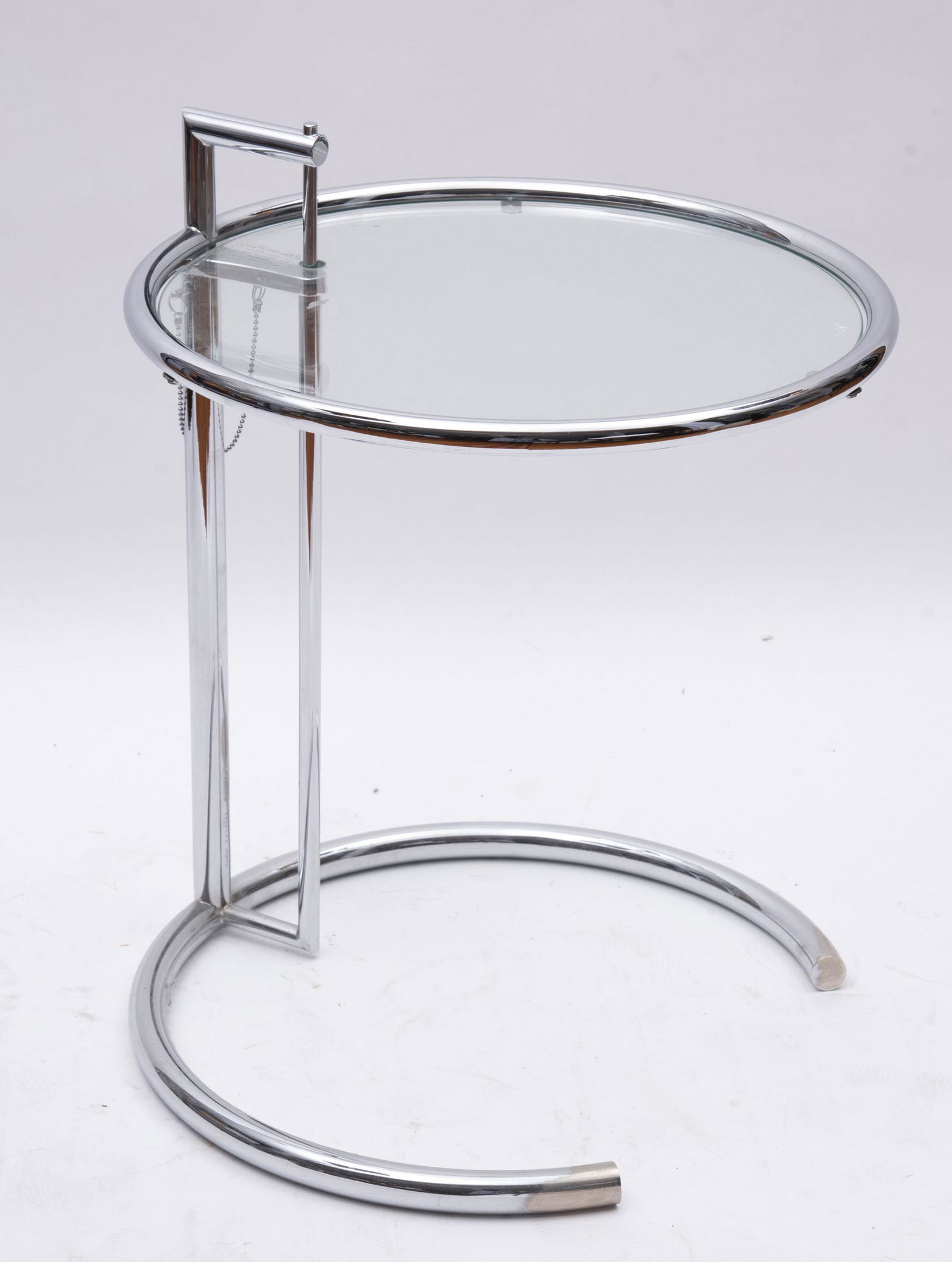 Eileen Gray adjustable table by Classicon: Eileen Gray adjustable table by Classiconadjustable table with distinctive shape of chrome and glass, prime example of classical modern design.