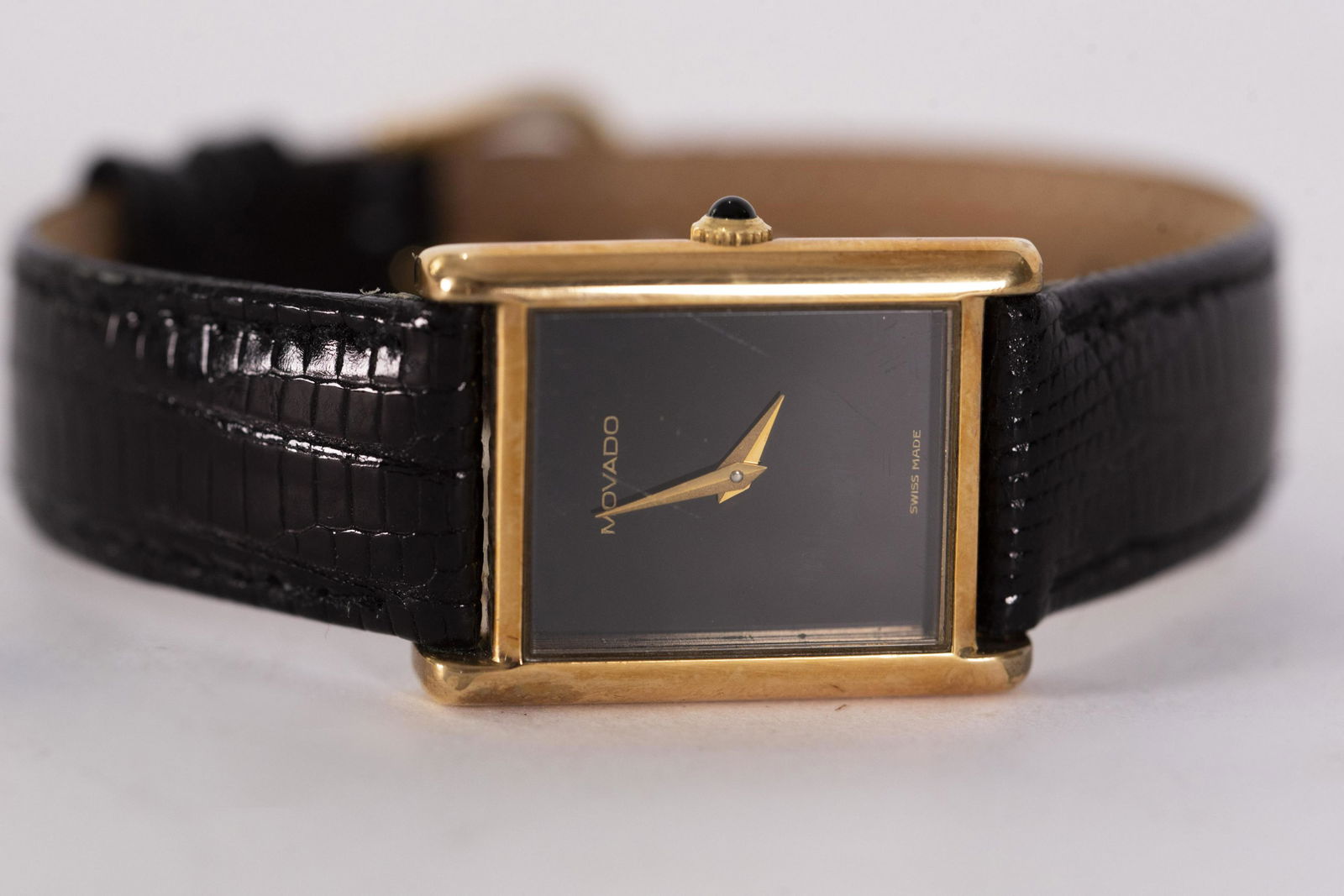 Mens Movado Watch with Leather Band: Mens Movado Watch with Leather BandGold plated with black face, black leather band, not running.