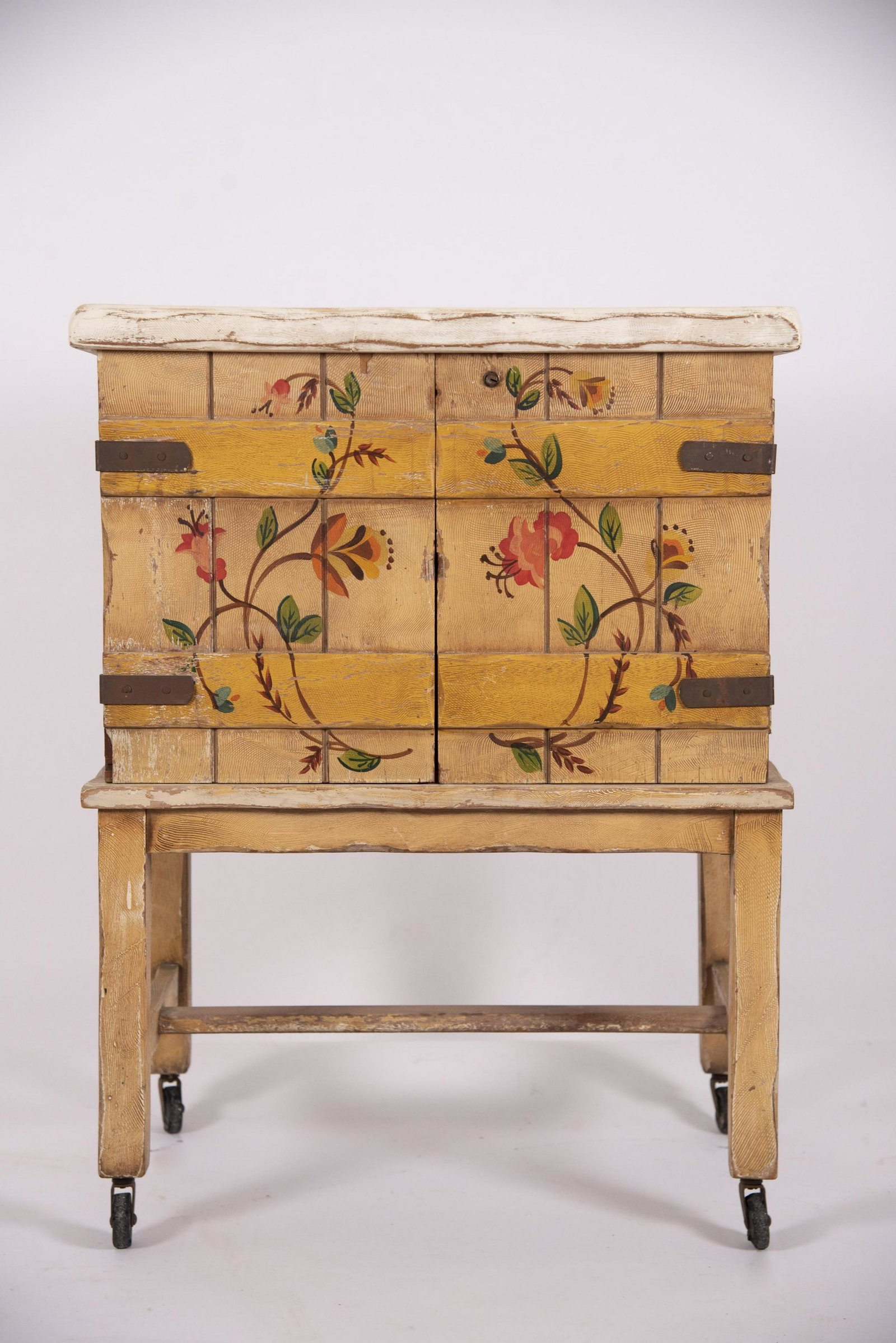 Monterey Furniture Painted Liquor Cabinet: Monterey Furniture Painted Liquor Cabinet The front painted with floral vines, and hinged with metal straps. Cabinet has a fitted interior.