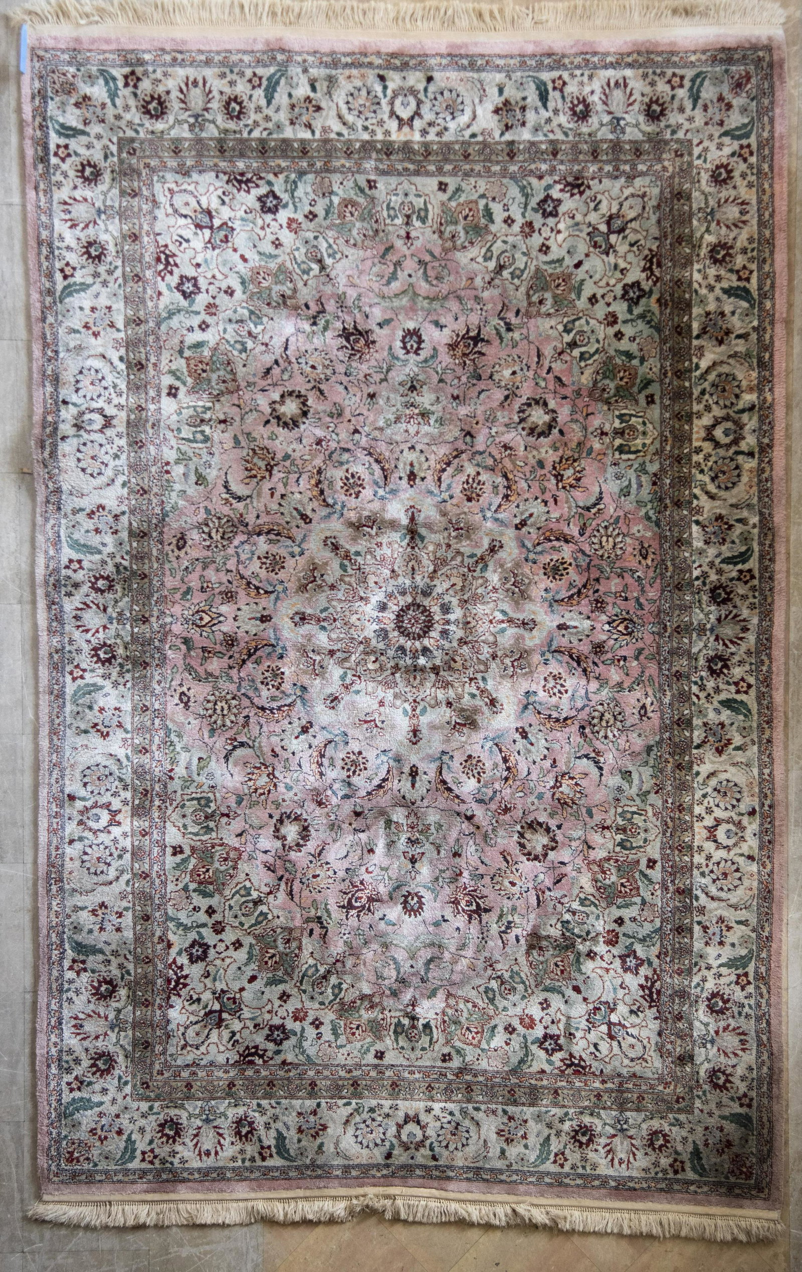 Persian Handwoven Silk And Wool Area Rug 6' x 9': Persian Handwoven Silk And Wool Area Rug kaleidoscope design central medallion within an ivory floral filled field all centering a matching border. 6' x 9'