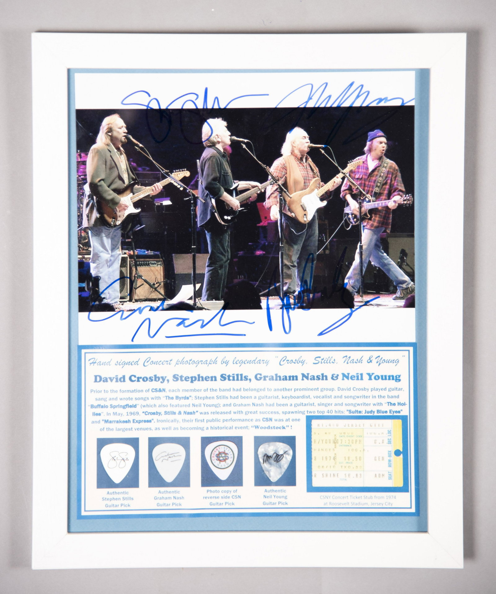 CSN & Y Signed Photo/ Ticket Stub/ Three Picks 11x14: CSN & Y Signed Photo/ Ticket Stub/ Three Picks Hand signed on stage concert photo by all four members, David Crosby, Stephen Stills, Graham Nash, and Neil Young of perennial favorite classic rock grou
