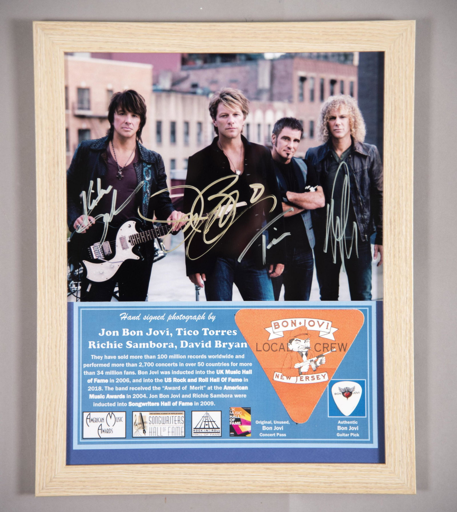 Bon Jovi Signed Photo/ Pass/ Pick 11x14 inches: Bon Jovi Signed Photo/ Pass/ Pick Hand signed photo by all “Bon Jovi” members: Jon Bon Jovi, Tico Torres, Richie Sambora and David Bryan. With an original, unused, concert pass and authentic guita