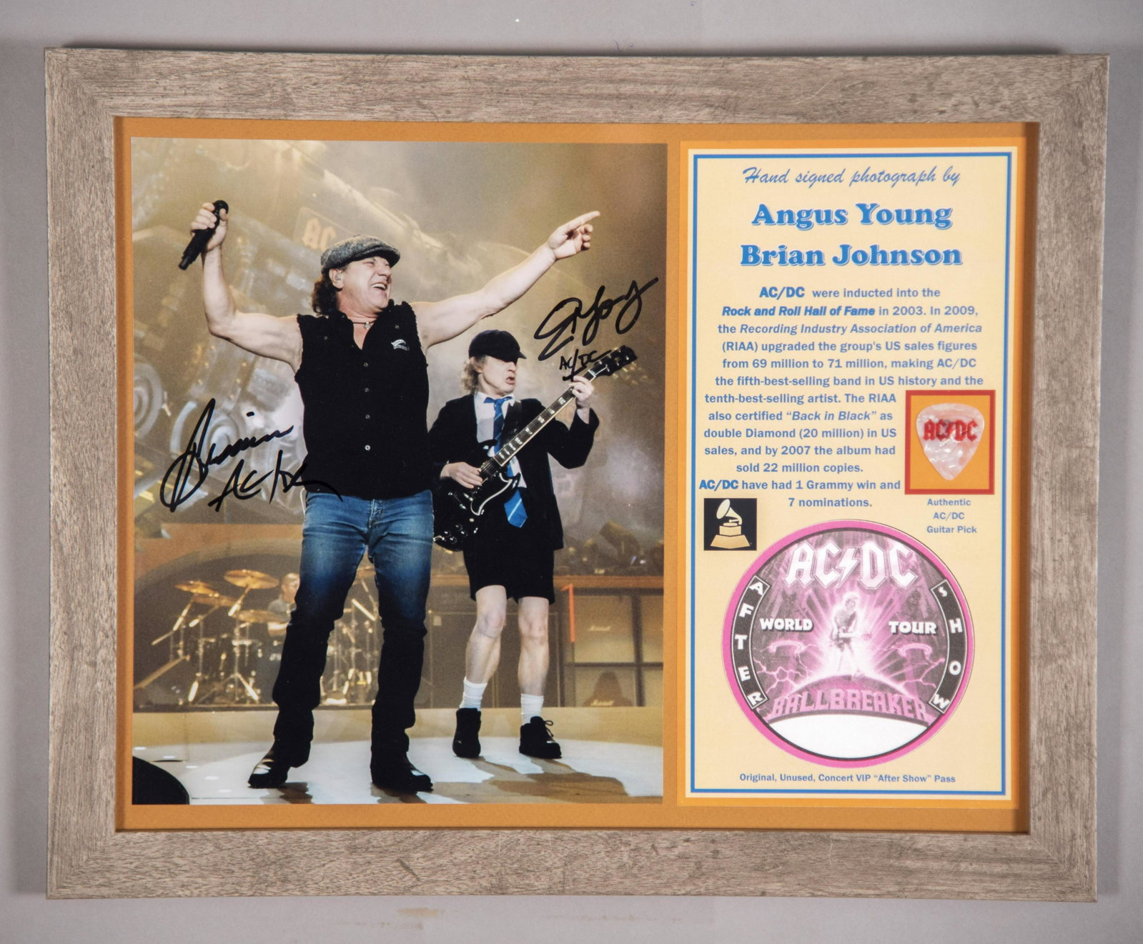 AC/DC Signed Photo/ Pass/ Pick 11x14 inches: AC/DC Signed Photo/ Pass/ Pick Hand signed photo by both Angus Young and Brian Johnson, leaders of AC/DC, the fifth best selling band in US History. Framed with VIP “After Show” concert pass plus 