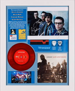 Weezer Signed Photo/ Seven Inch Record And Cover/ Pick: WEEZER SIGNED PHOTO/SEVEN INCH RECORD AND JACKET/PICKHand signed photo by all Weezer band members: Rivers Cuomo, Patrick Wilson, Brian Bell, and Scott Shriner. Multiplatinum success with their Blue Al