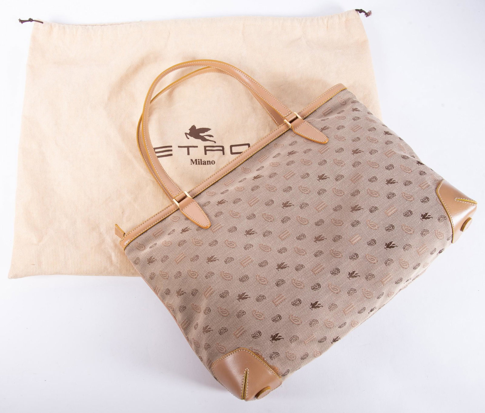 Italian Etro Handbag: Italian Etro Handbagbeige patterned design canvas fabric, label marked Milano, Made in Italy, orange fabric interior with zipped pocket; with leather handles.16 x 11 inches
