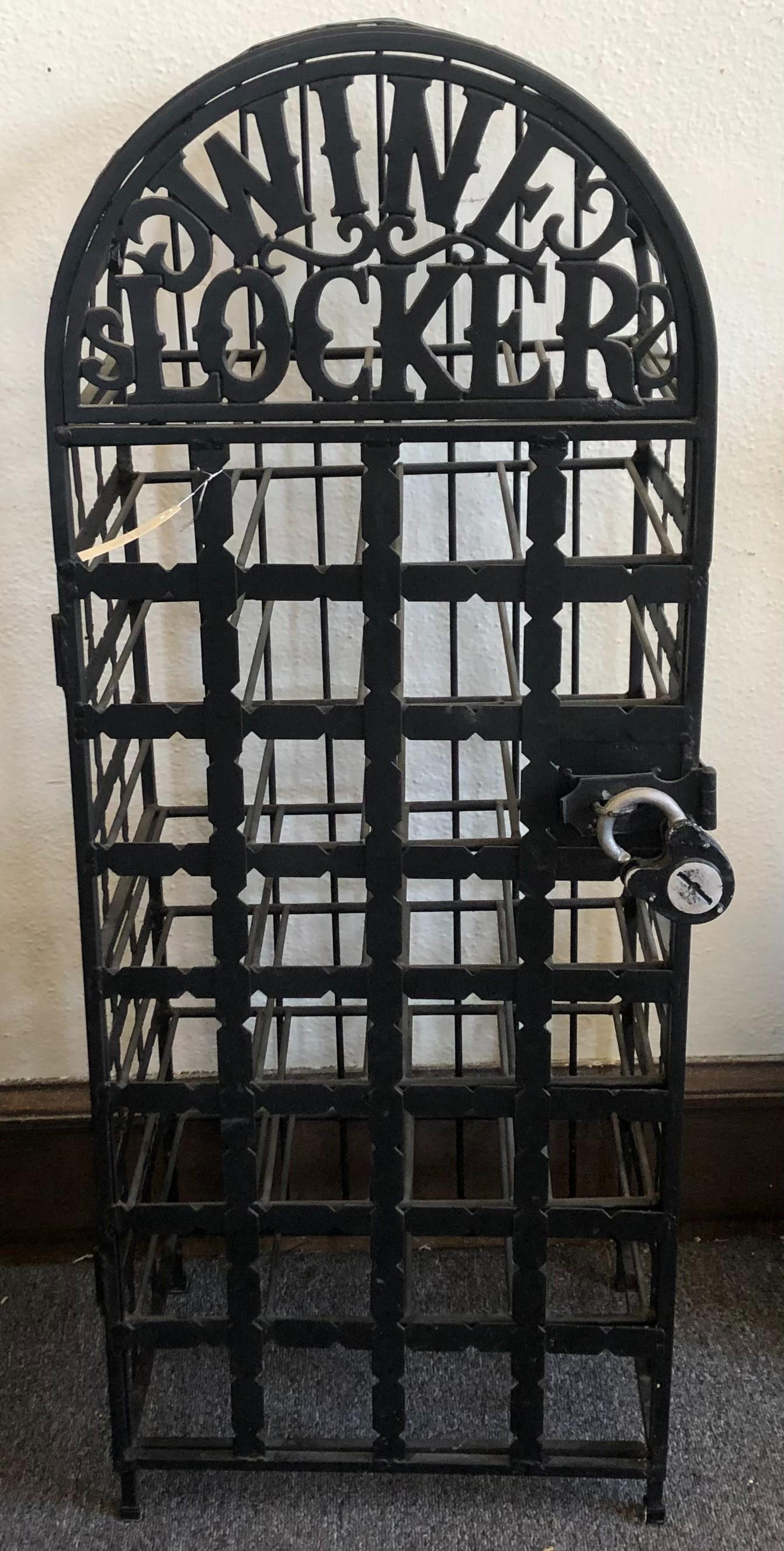 20th Century Wrought Iron Black Painted Wine Rack/ Locker: 20th Century Wrought Iron Black Painted Wine Rack/ Locker Arched form with thirty two slots within a hinged door. Height 44 inches