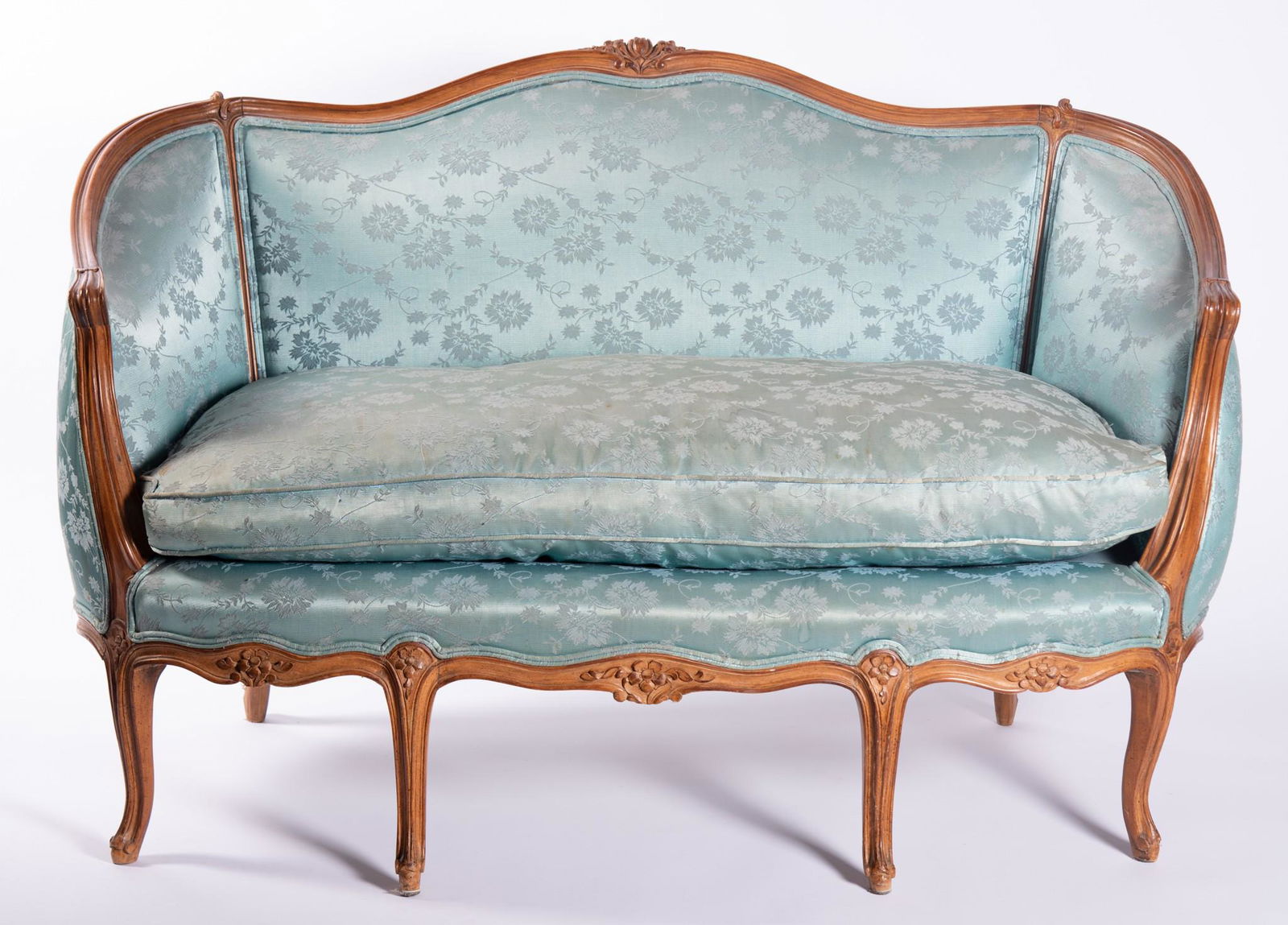 Pair Of 20th Century French Louis XV Style Settees: Pair Of 20th Century French Louis XV Style SetteesEach having carved foliate and serpentine form top rail above a blue floral upholstered back rest and matching seat with carved and shaped apron resti