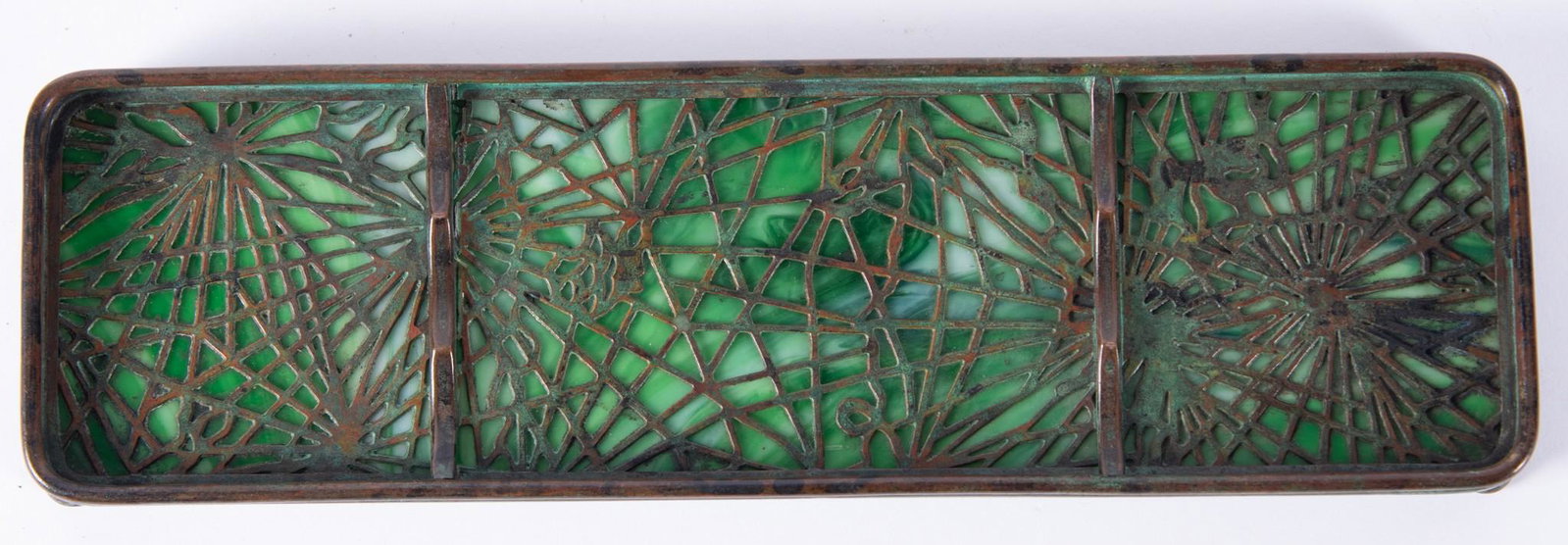 Tiffany Pine Needle Pen Tray: Tiffany Pine Needle Pen Tray Bronze footed tray with pierced pine needle pattern over green slag glass marked Tiffany Studios 1004 Length: 9 3/4 inches; Width: 2 7/8 inches