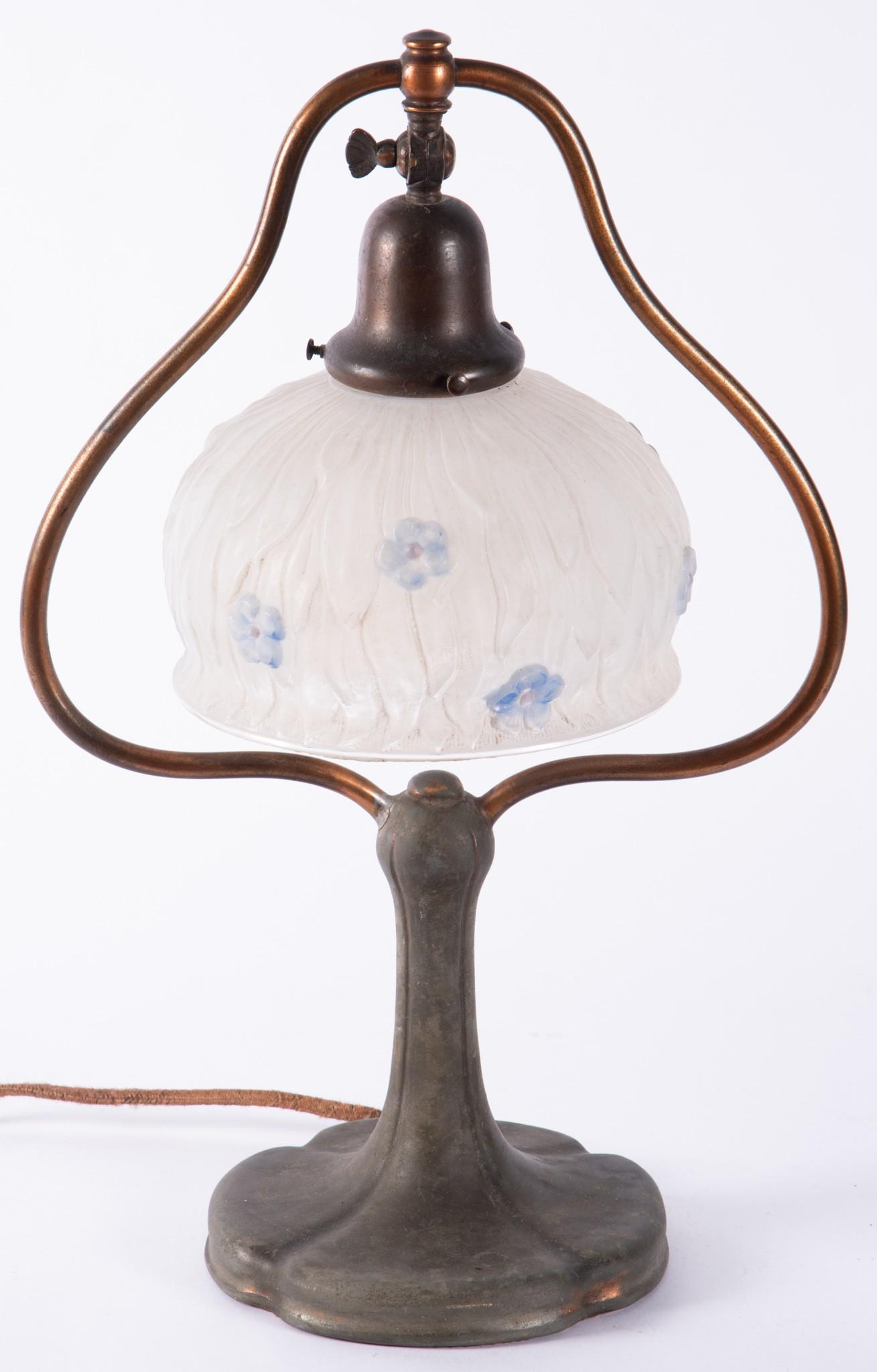 An Antique Handel Harp Desk Lamp: An Antique Handel Harp Desk Lamp Base signed to rear of base "Handel", paper label to base. With an associated embossed glass lamp. 17" tall
