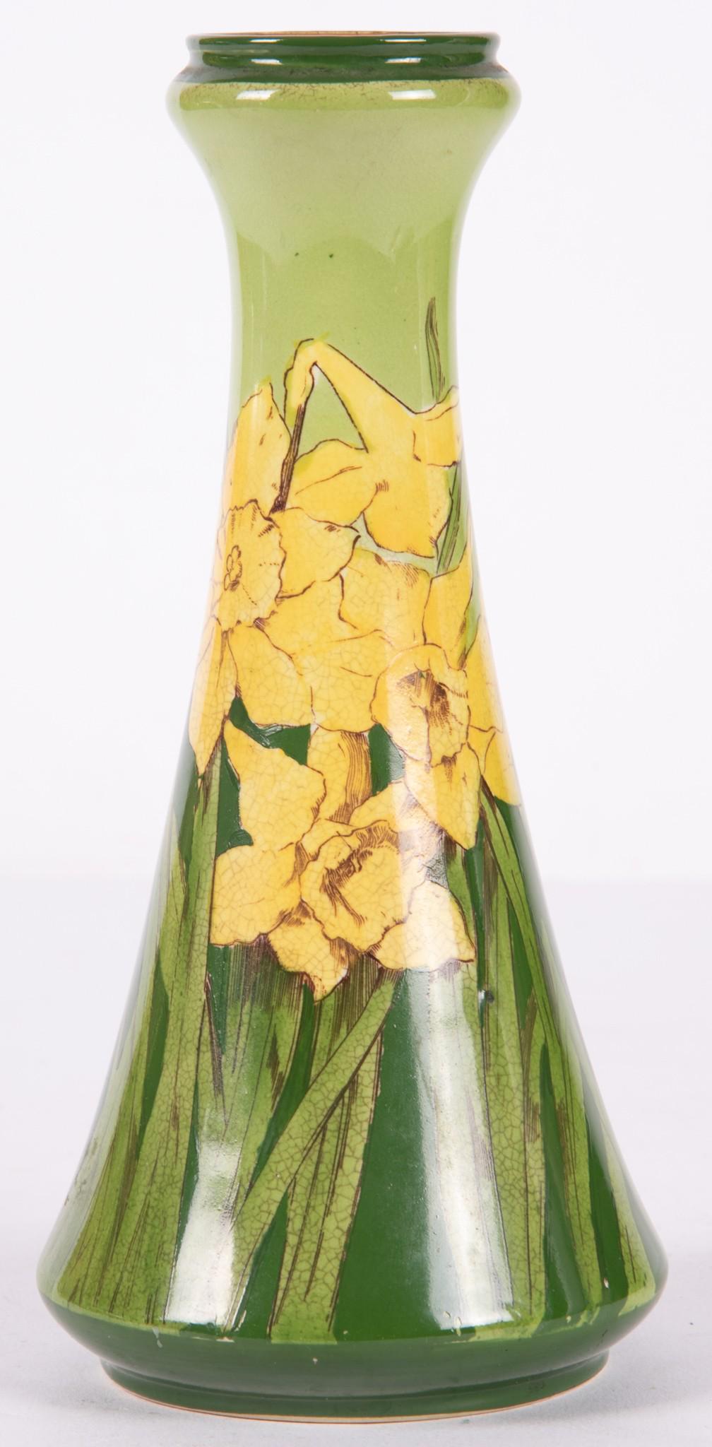 A George Jones and Sons Pottery Vase: A George Jones and Sons Pottery Vase Marked with the Jones and Sons crescent mark, England, the vase painted with daffodils in the secessionist style. 8 1/4" tall