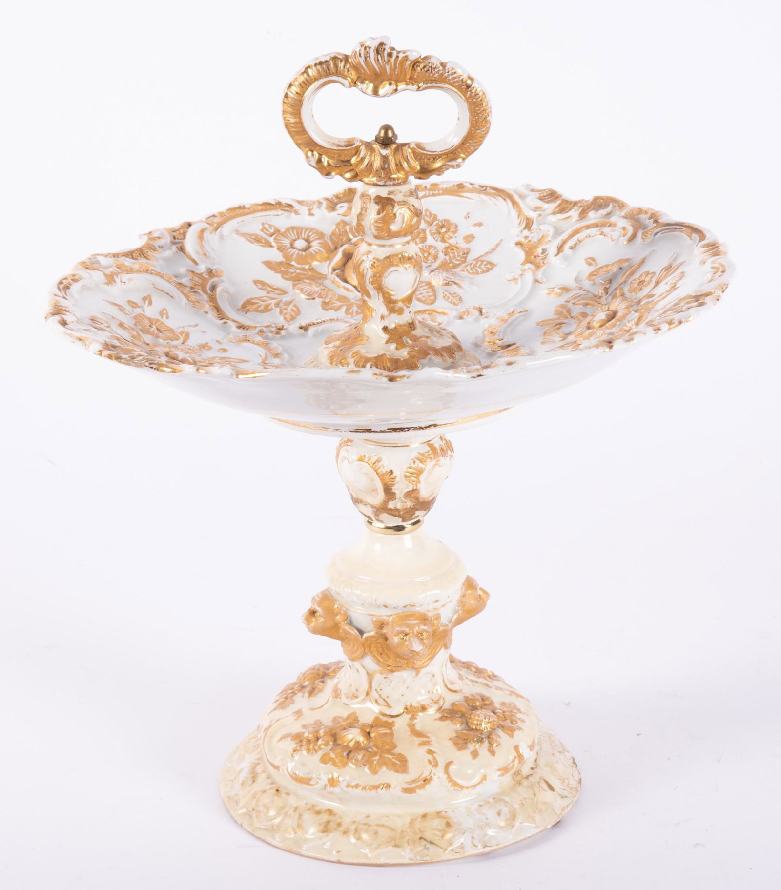 An Antique Meissen Porcelain Handled Compote: An Antique Meissen Porcelain Handled Compote White ground with gilt highlights, the stem of the base featuring winged creatures. 13"