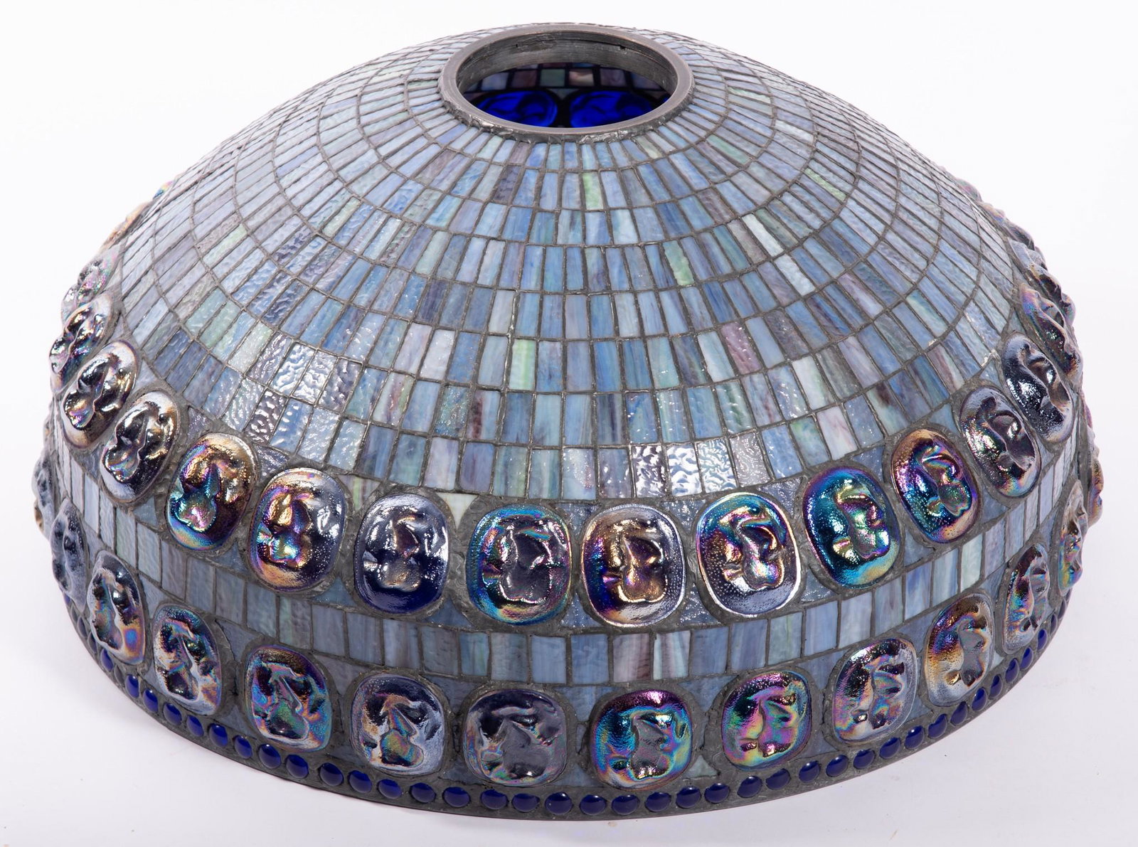 A Monumental Tiffany Style Turtle Back Tile and Slag Glass Lamp Shade: A Monumental Tiffany Style Turtle Back Tile and Slag Glass Lamp Shade A large art glass lamp shade with a double row of turtle back tiles (56 total) in a dark blue/purple iridescent color. Approximate