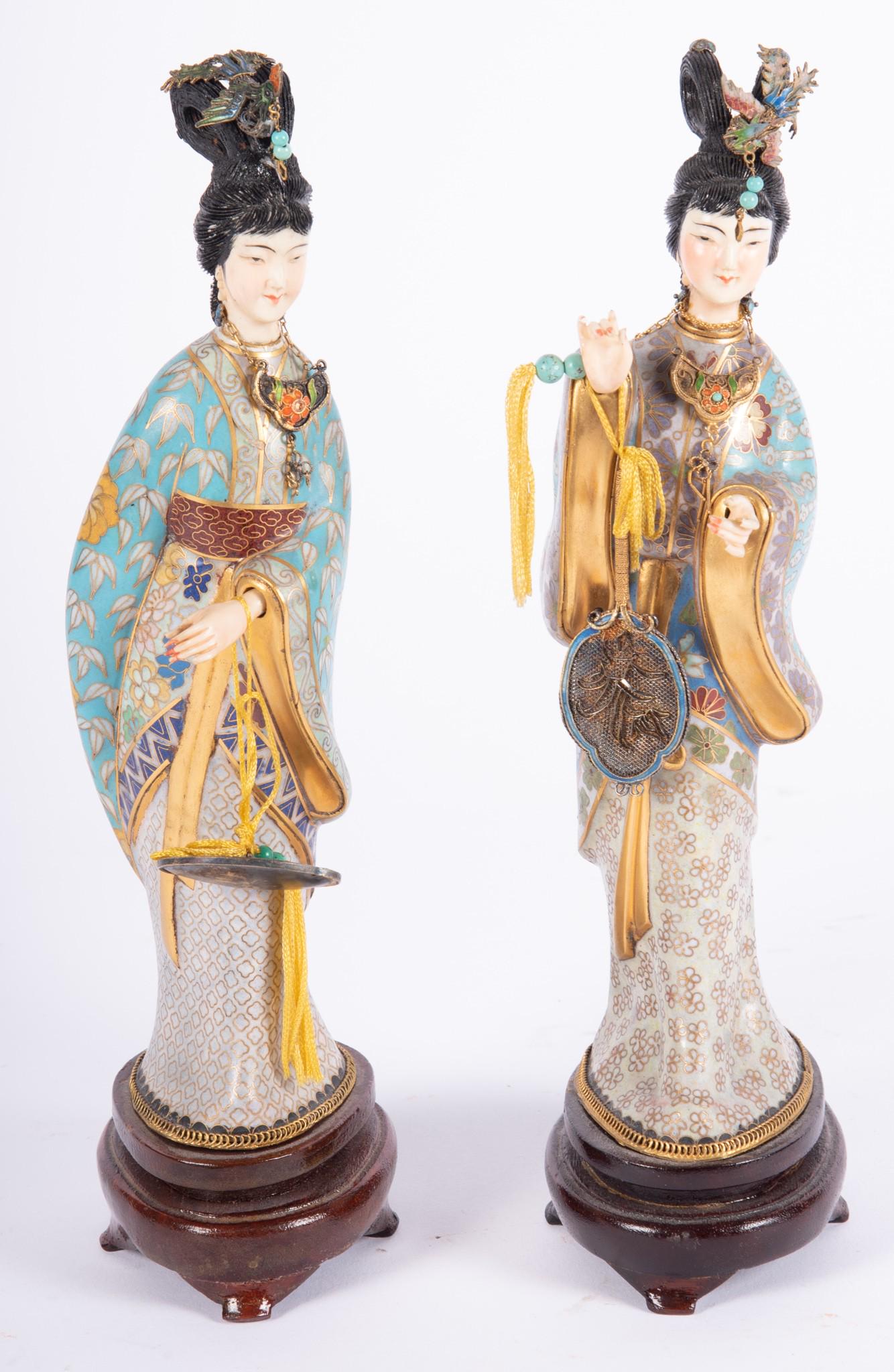 Pair of Vintage Chinese Cloisonne Female Figures: Pair of Vintage Chinese Cloisonne Female Figures with ivory face and hands, decorated head and neck jewelry; affixed on wood stands. Height 10 1/2 inches