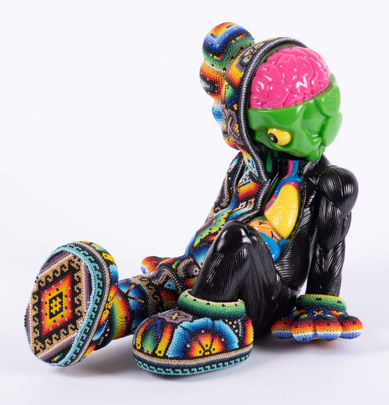 Rick Wolfryd, California, Mexico (1953 -), Seated Kaws 2, beading on polychrome figure (1 of 4)