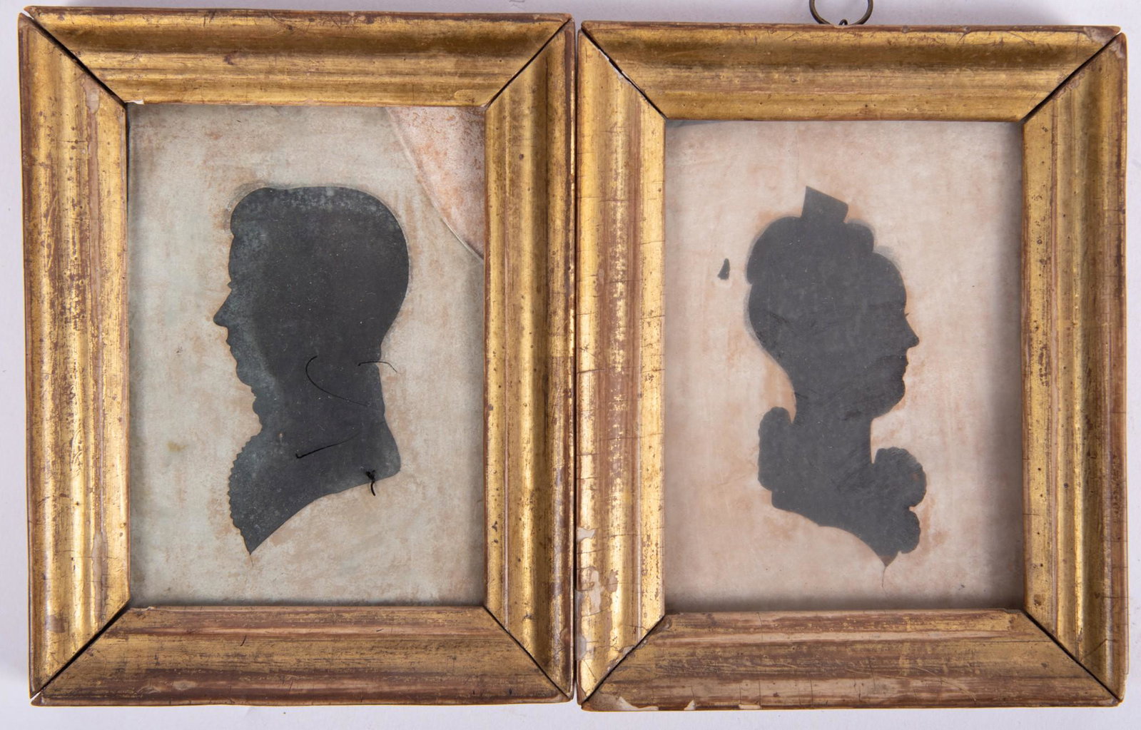 Pair of Hollow Cut Silhouettes of Man and Woman: Pair of Hollow Cut Silhouettes of Man and Woman in lemon gold frames. 4 7/8 x 3 7/8 inches