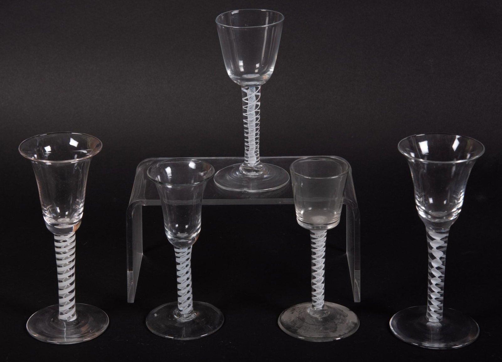 Collection of Five Mold Blown Wine Goblets: Collection of Five Mold Blown Wine Goblets with white glass spiraling design in the stems. (rough pontil) Tallest 6 1/2 inches