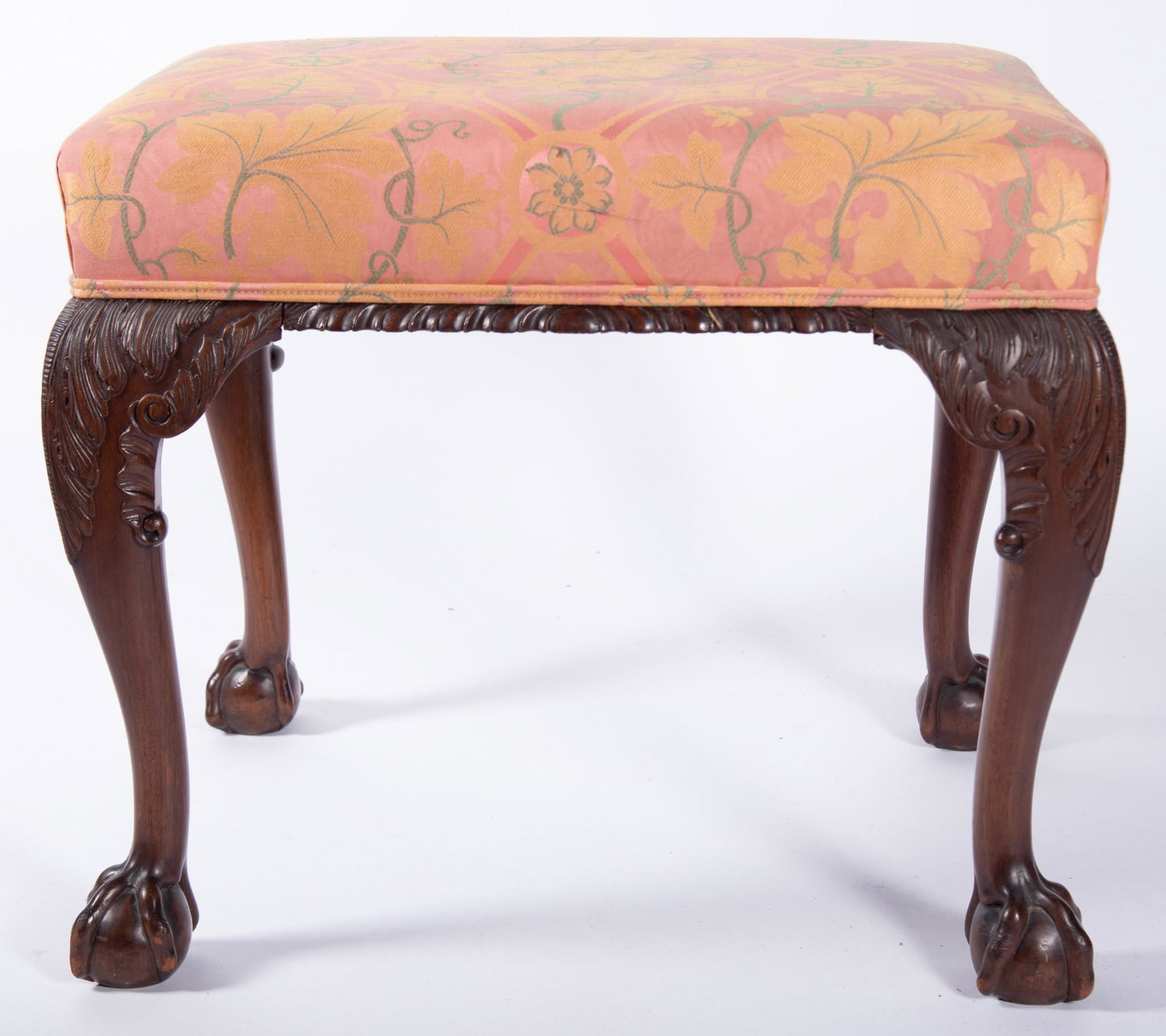 Antique American Nineteenth Century Chippendale Design Bench: Antique American Nineteenth Century Chippendale Design Bench Floral upholstered rectangular seat on four legs with carved shoulders ending with three knuckle claw and ball feet. 21 x 24 1/2 x 20 inche