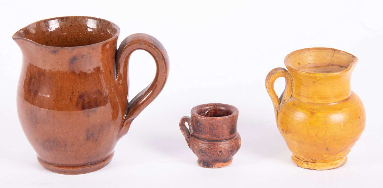Three Small Redware Pitchers (1 of 3)