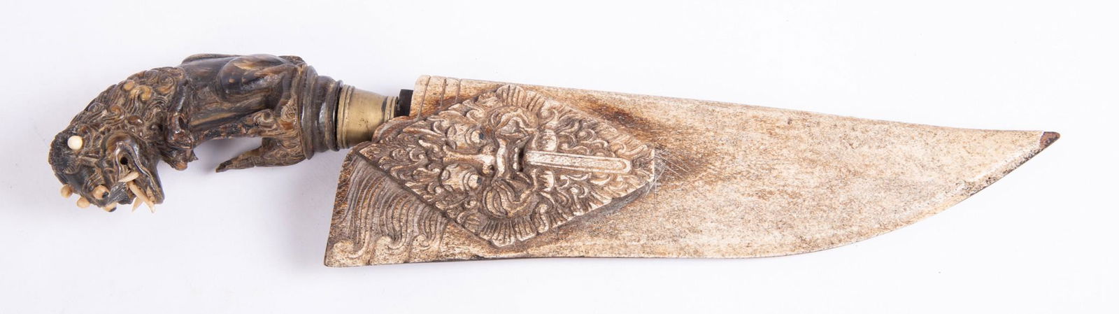 Chinese Dagger With Carved Bone Handle and Sheath, 19th Century: Chinese Dagger With Carved Bone Handle and Sheath, 19th CenturyFoo Lion carved bone handle, with carved bone sheath depicting face; imperfection foo lion paw and missing one fang.Overall length 14 inc