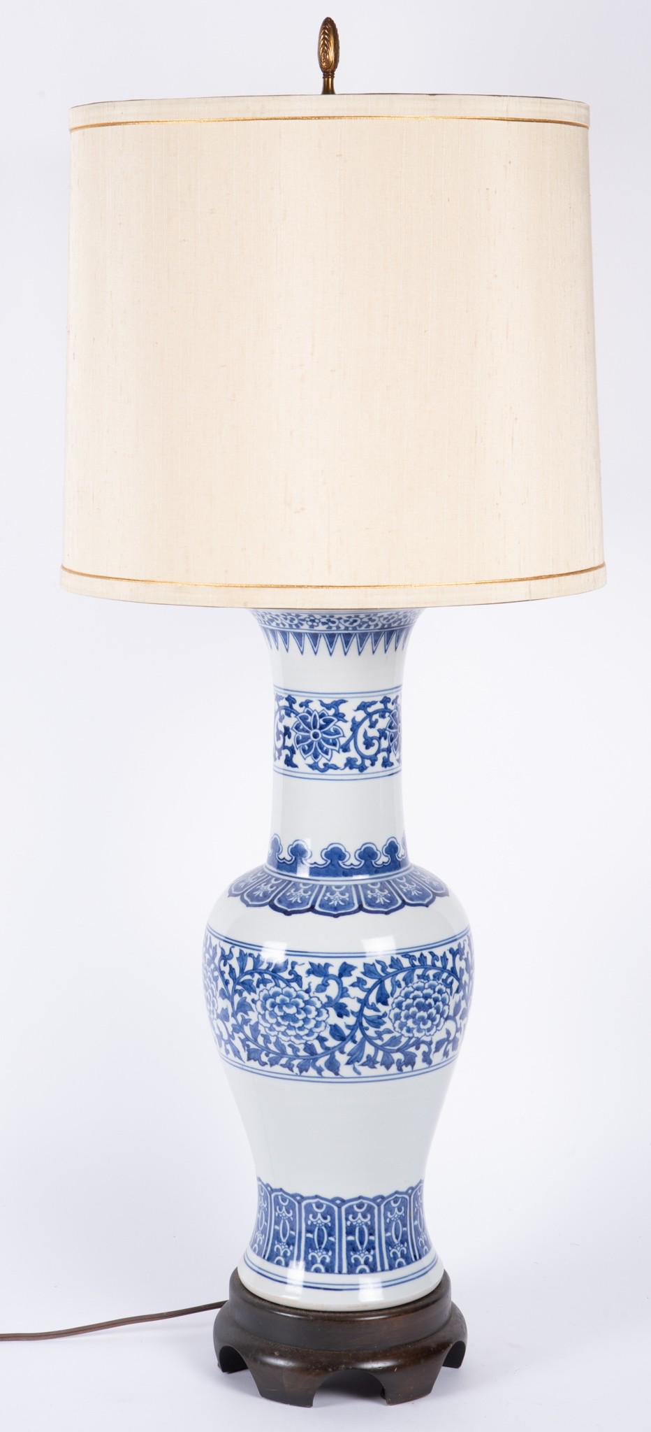 A Chinese Inspired Frederick Cooper Baluster Form Lamp: A Chinese Inspired Frederick Cooper Baluster Form LampA blue/white porcelain table lamp on wooden base.35" to finial tip