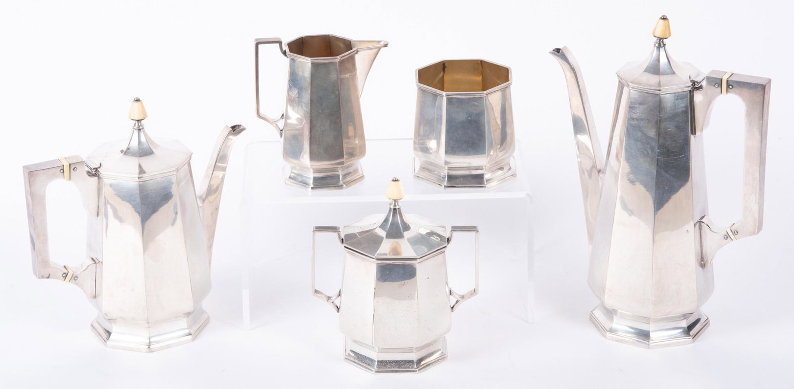 A Fine American Art Deco Sterling Silver Tea Service (5pc), Circa 1925: A Fine American Art Deco Sterling Silver Tea Service (5pc), Circa 1925 American, circa 1925, a high style Deco five piece sterling silver tea set, Barbour Silver Co., Hartford Connecticut. The set com