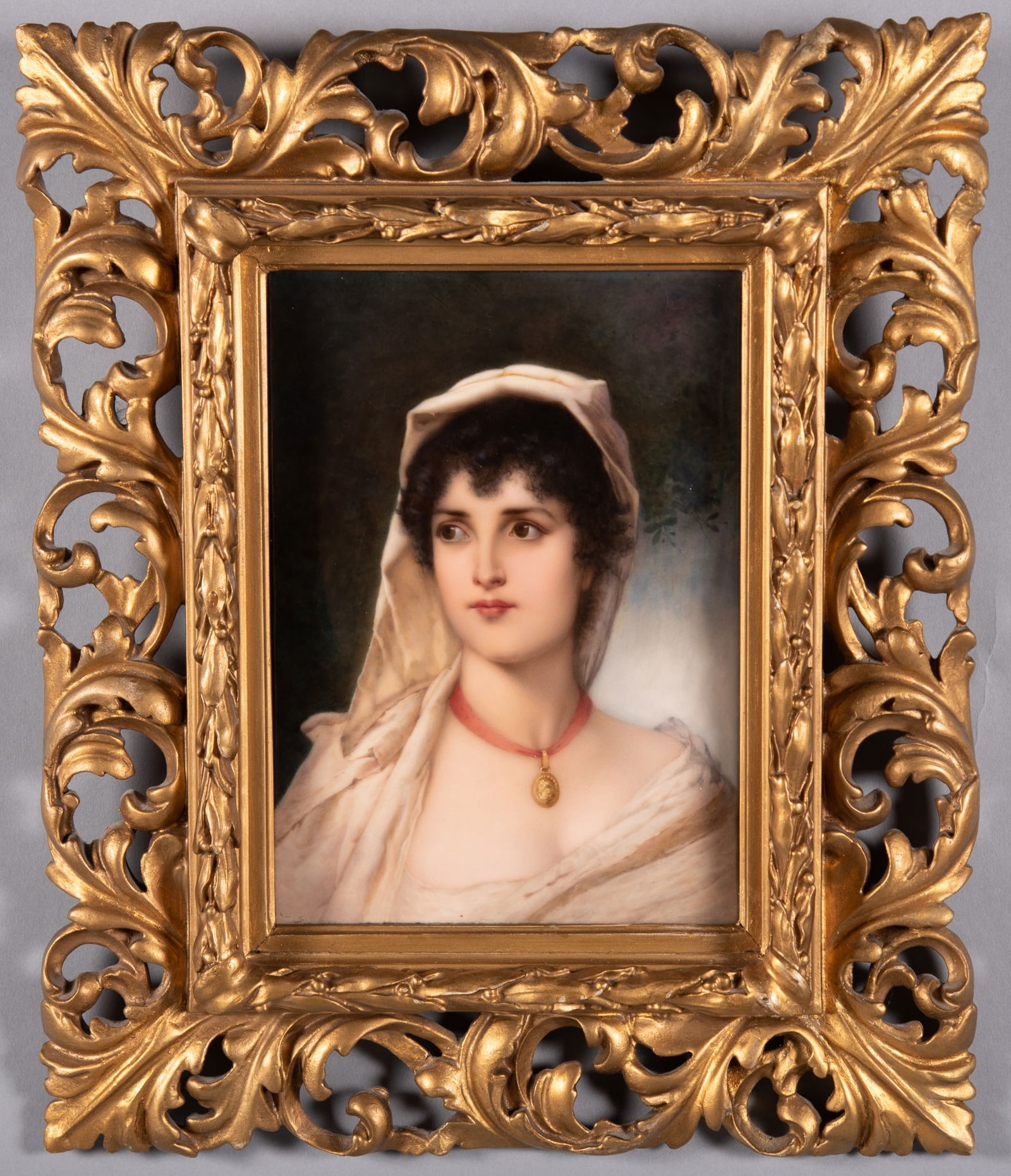 A Fine KPM Portrait Plaque, Neapolitan Girl: A Fine KPM Portrait Plaque, Neapolitan GirlA finely painted KPM plaque of a young beauty wearing a head scarf and gold pendant necklace. Impressed KPM with scepter mark, 237 158, porcelain plaque size