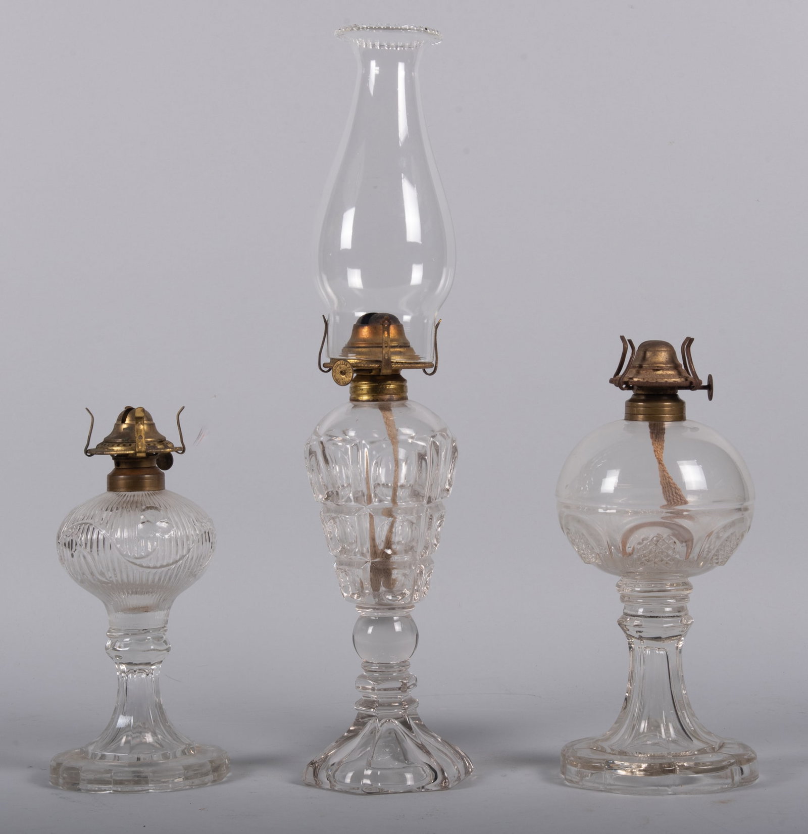 Three Antique American Whale Oil Lamps, 19th Century: Three Antique American Whale Oil Lamps, 19th Century of various early patterns