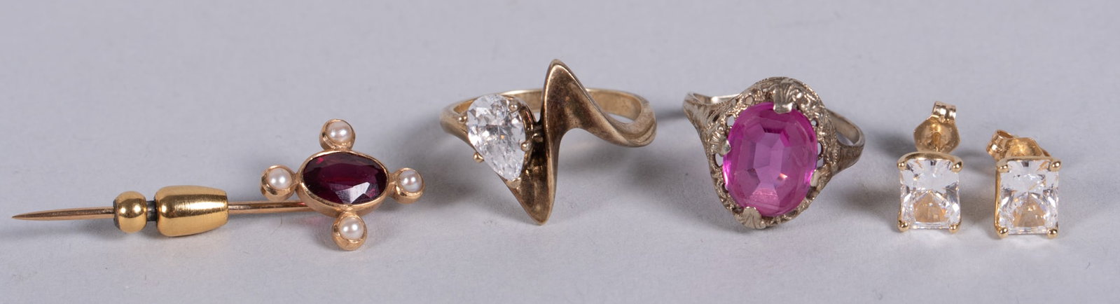 Collection of Gold Jewelry: Collection of Gold Jewelry 14kt yellow gold ring with cubic zirconia, 14kt yellow gold post stud earrings with cubic zirconia, 14kt white gold ring (damaged) with pink stone, garnet and pearl small st
