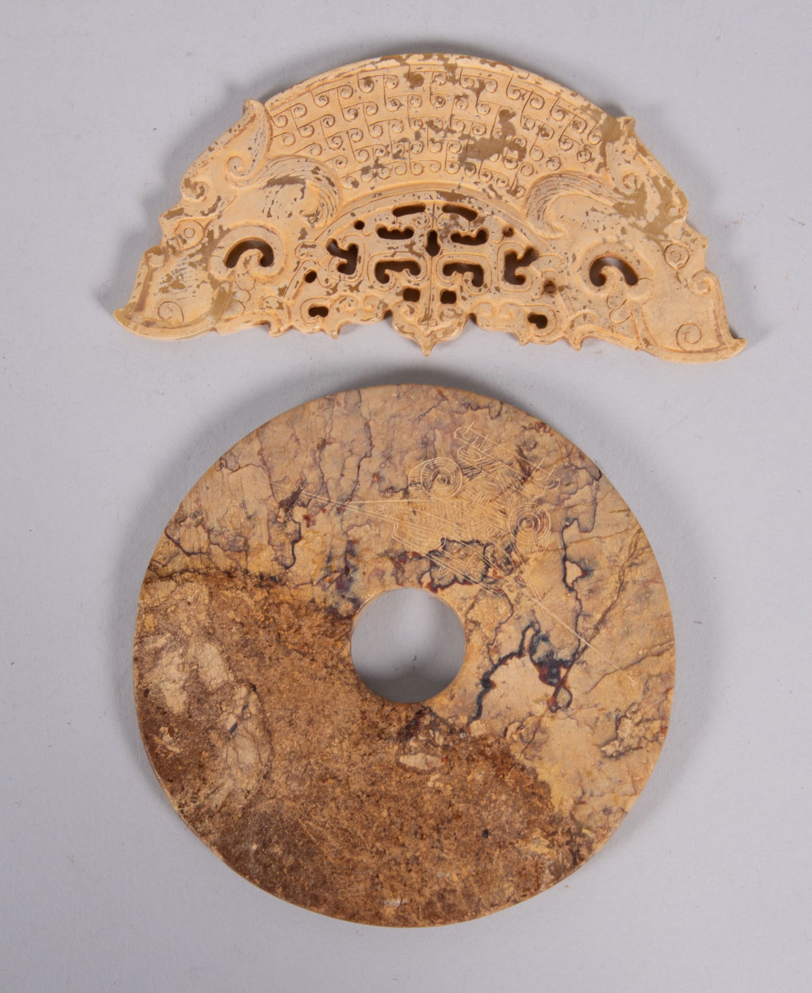 A Carved Chinese Calcified Jade Ornament and Hardstone "Bi" (1 of 3)