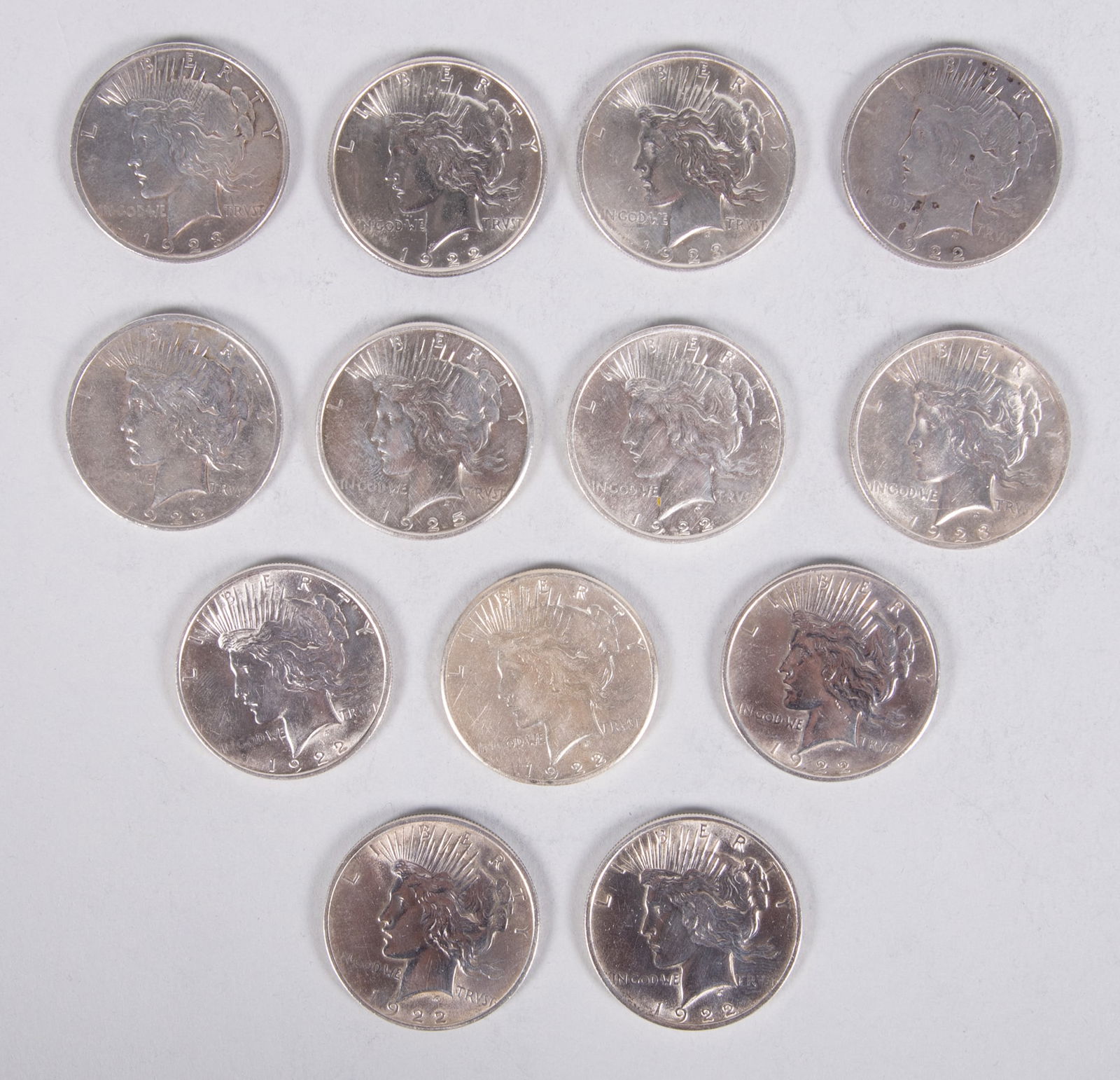 Peace Dollars 13x (nine 1922 two D two S, three 1923, and one 1925) (1 of 4)