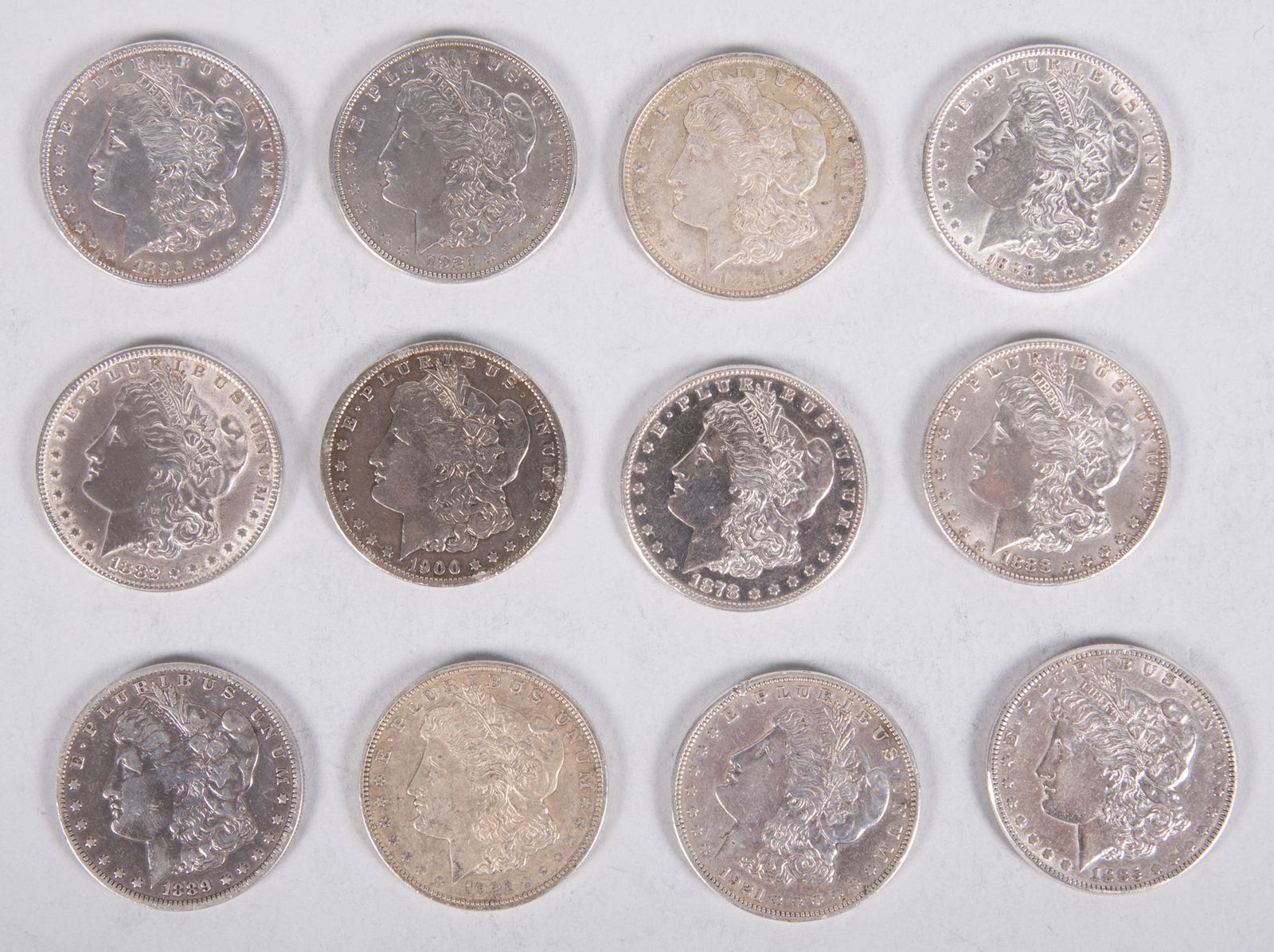 Morgan Dollars 12x (1878 S, 1882, 1885, two 1888, 1889 O, 1896, 1900 O, and three 1921 D, and one (1 of 4)