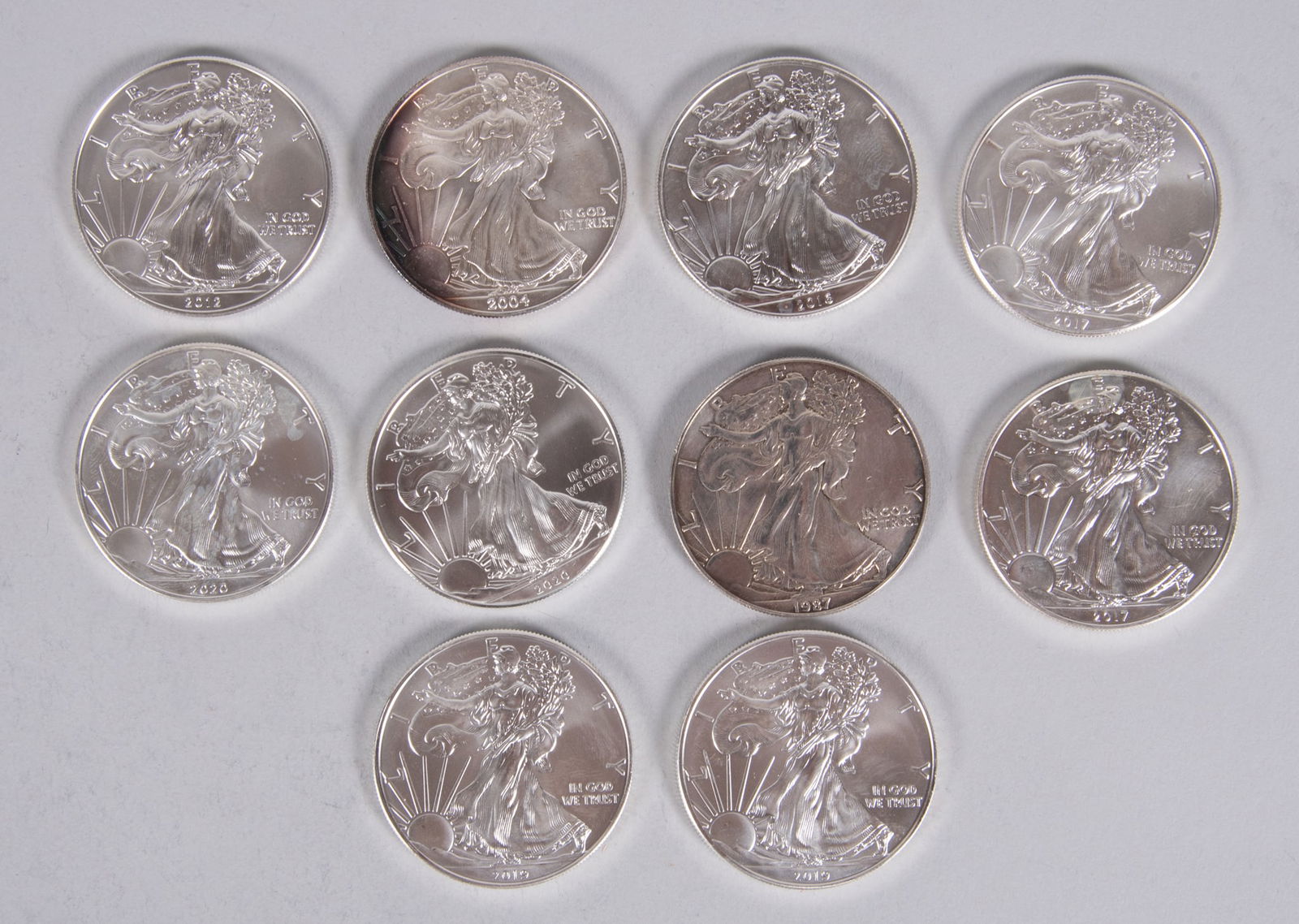 10 Uncirculated Silver Eagles (1987, 2004, 2012, 2016, two 2017, two 2019, and two 2020) (1 of 5)