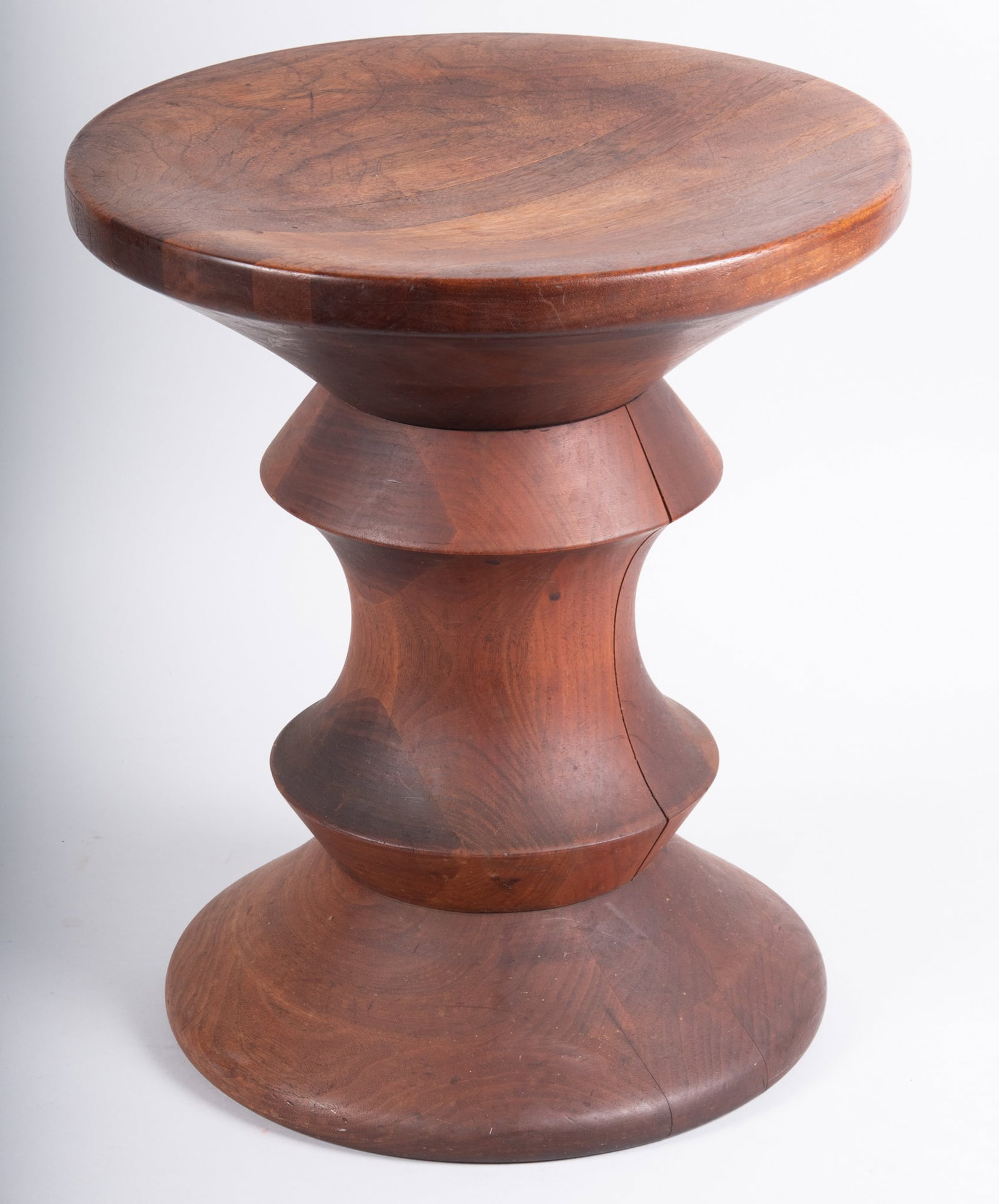 Charles and Ray Eames for Herman Miller Vintage Walnut Time Life Stool, circa 1960s: 'Shape A' solid walnut stool or side table. The top and bottom are both concave so the orientation is interchangeable.Provenance: The Estate of Royce G. Engel (1930-2023)Royce G. Engel worked as an in