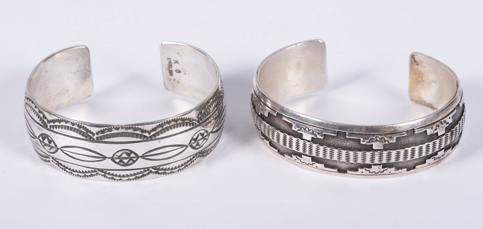 Native American Navajo Cuff Bracelets Two Pieces: Native American Navajo Cuff Bracelets Two PiecesBoth cuffs have an approximate circumference of 5 1/2" with a 1" gap. One is signed with a K & the sterling mark, other unsigned. Total weight