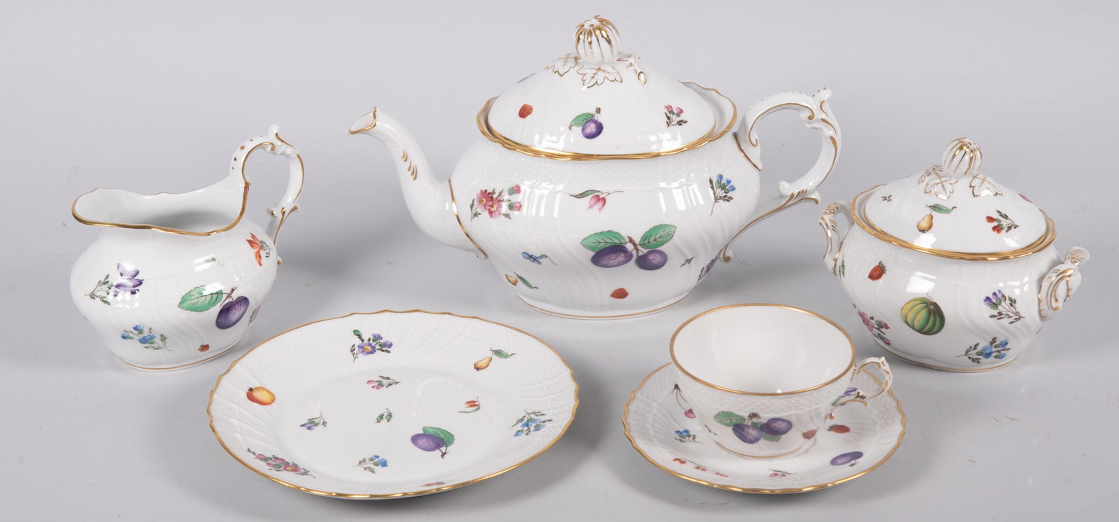 Porcelain Dessert Set by Richard Ginori: Porcelain Dessert Set by Richard Ginori Beautiful porcelain dessert service designed by Richard Ginori, Italy with floating flowers and fruits on white fields with gold gilt trim. This lot consists of