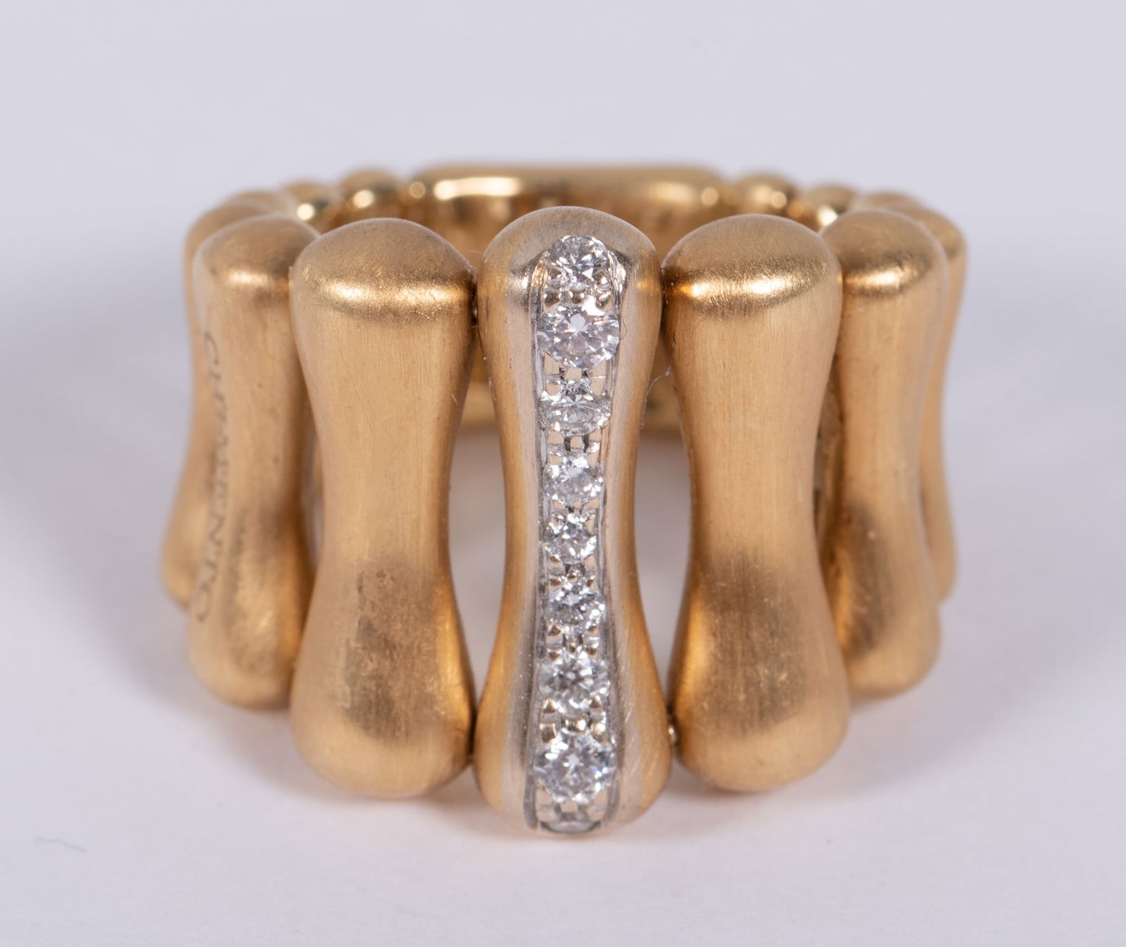 An 18k Gold Italian Chimento Bamboo Over Ring: An 18k Gold Italian Chimento Bamboo Over RingItaly, by the design firm Chimento, an 18k gold ring with approximately .27 carats of diamonds. 12 gram gold weight, ring size approximately 6.5.