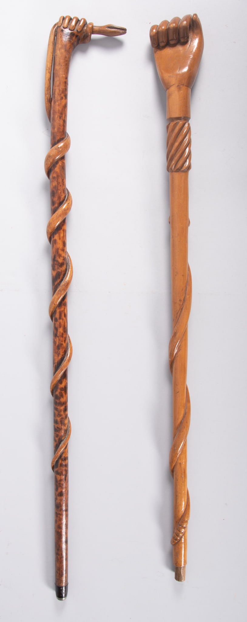 Pair of Carved Wooden Canes with Hands as Handles (1 of 3)