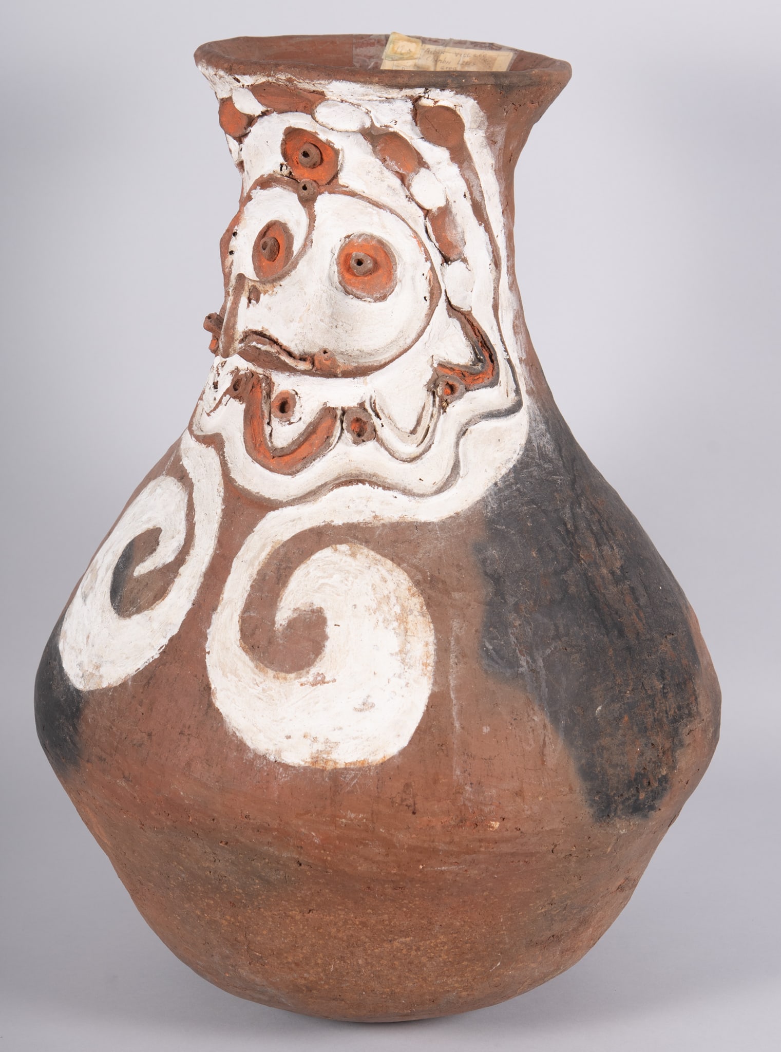 Large Chambri Lakes Pottery Face Sago Flour Pot: Large Chambri Lakes Pottery Face Sago Flour Pot Fun whimsical Papua New Guinea terra cotta sago flour pot with a raised anthropomorphic face design to the top and decorated with natural pigments. A ve