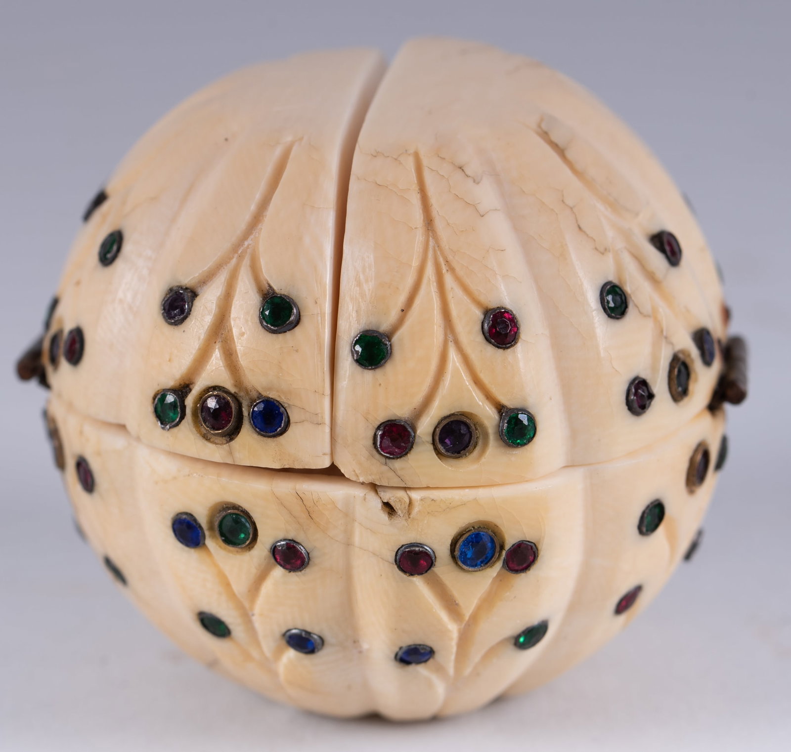 An Unusual Continental Carved Bone Triptych Ball, 19th Century: An Unusual Continental Carved Bone Triptych Ball, 19th Century Likely Dieppe, 19th century, a uniquely carved hinged ball. The exterior inlaid with colorful blue, green and red stones in a floral patt