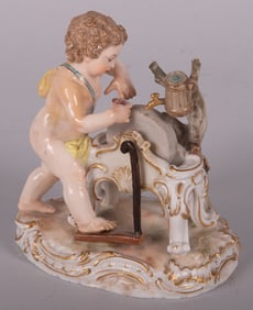 A Meissen Figure of Cupid Sharpening His Arrow