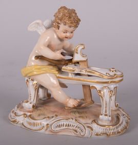 A Meissen Figure of Cupid Carving His Bow
