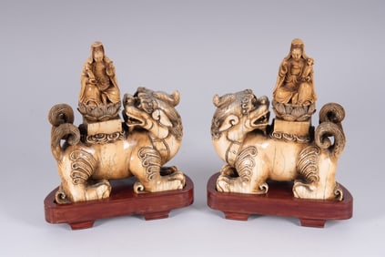 A Fine Pair of Carved Buddhistic Figures of Shishi or Foo Dogs