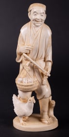 A Japanese Okimono of a Farmer and his Hen