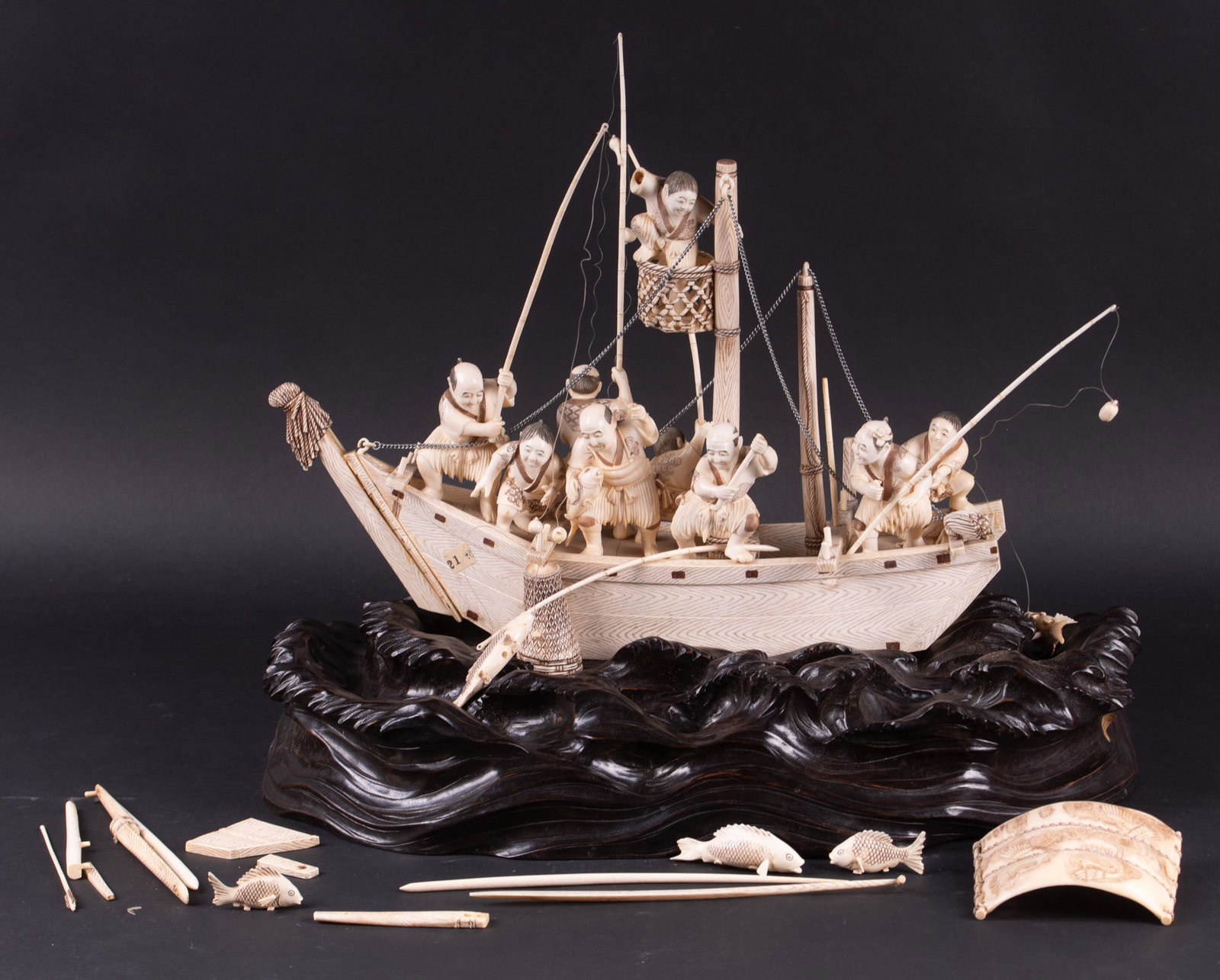 An Incomplete Fisherman's Boat Made of Carved Bone: An Incomplete Fisherman's Boat Made of Carved Bone missing pieces, broken pieces, separated pieces approx 13 inches height, 17 inches length