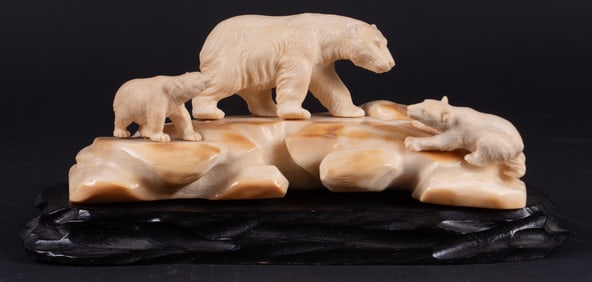 A Figural Bone Carving of a Polar Bear and Cubs