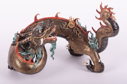 An Elaborate Chinese Porcelain Figure of a Dragon